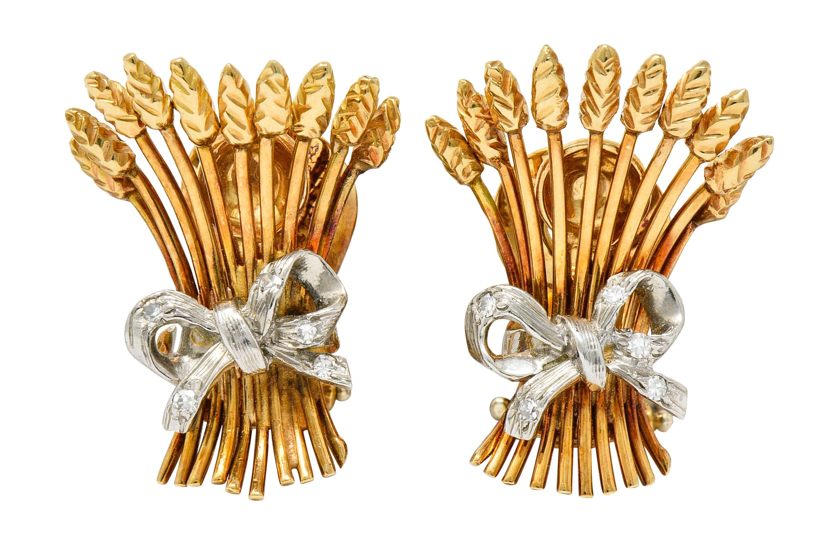 Designed as bundles of polished gold wheat cinched by a platinum ribbon

Accented by transitional and single cut diamonds weighing in total approximately 0.95 carat; G to I color with SI clarity

Earrings are completed by hinged omega backs

Brooch