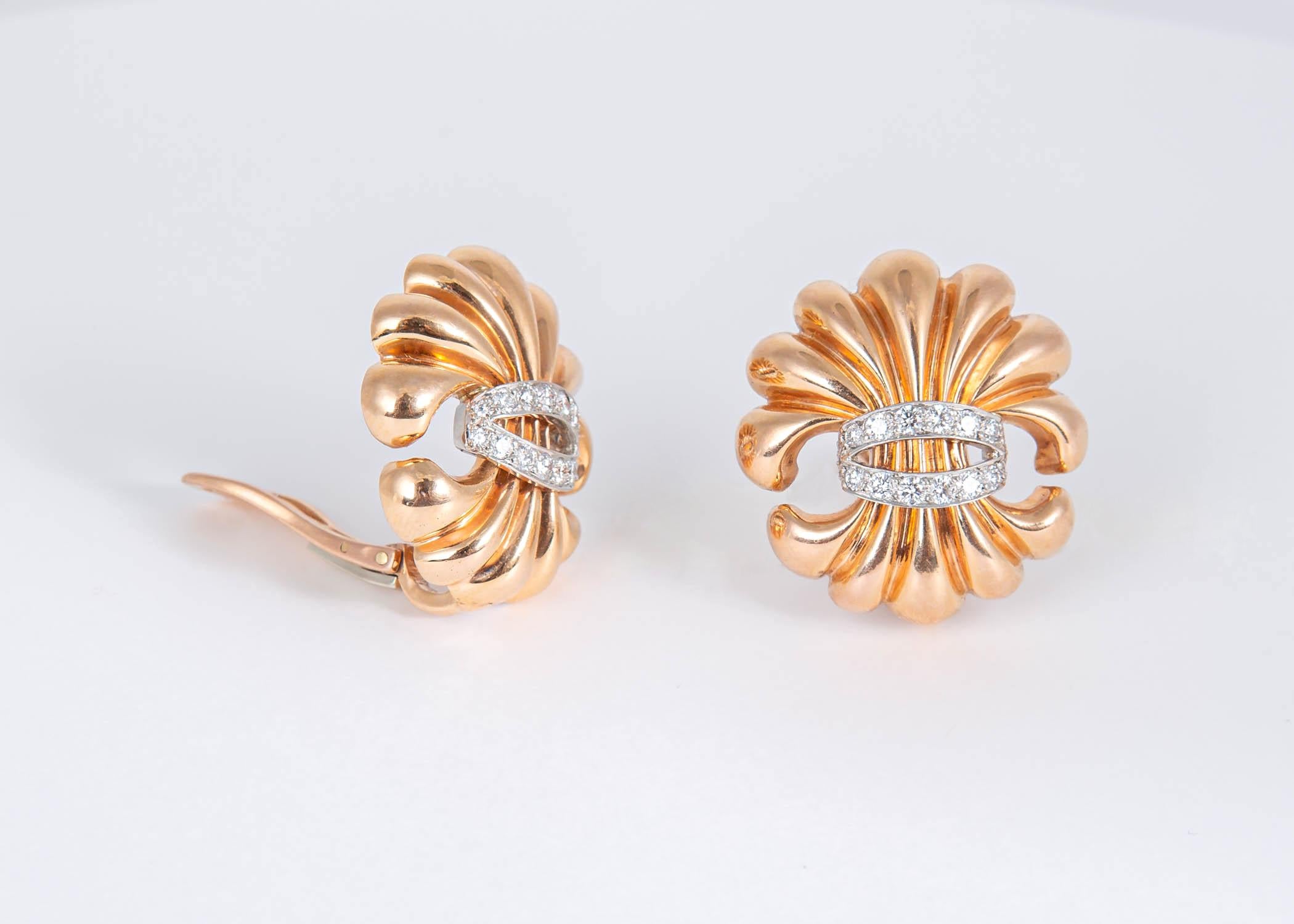 The Verdura Fleur-de-lis rose gold earrings are rare and collectable. A truly elegant design accented with brilliant cut diamonds. Approximately 1 1/8 inches in size.