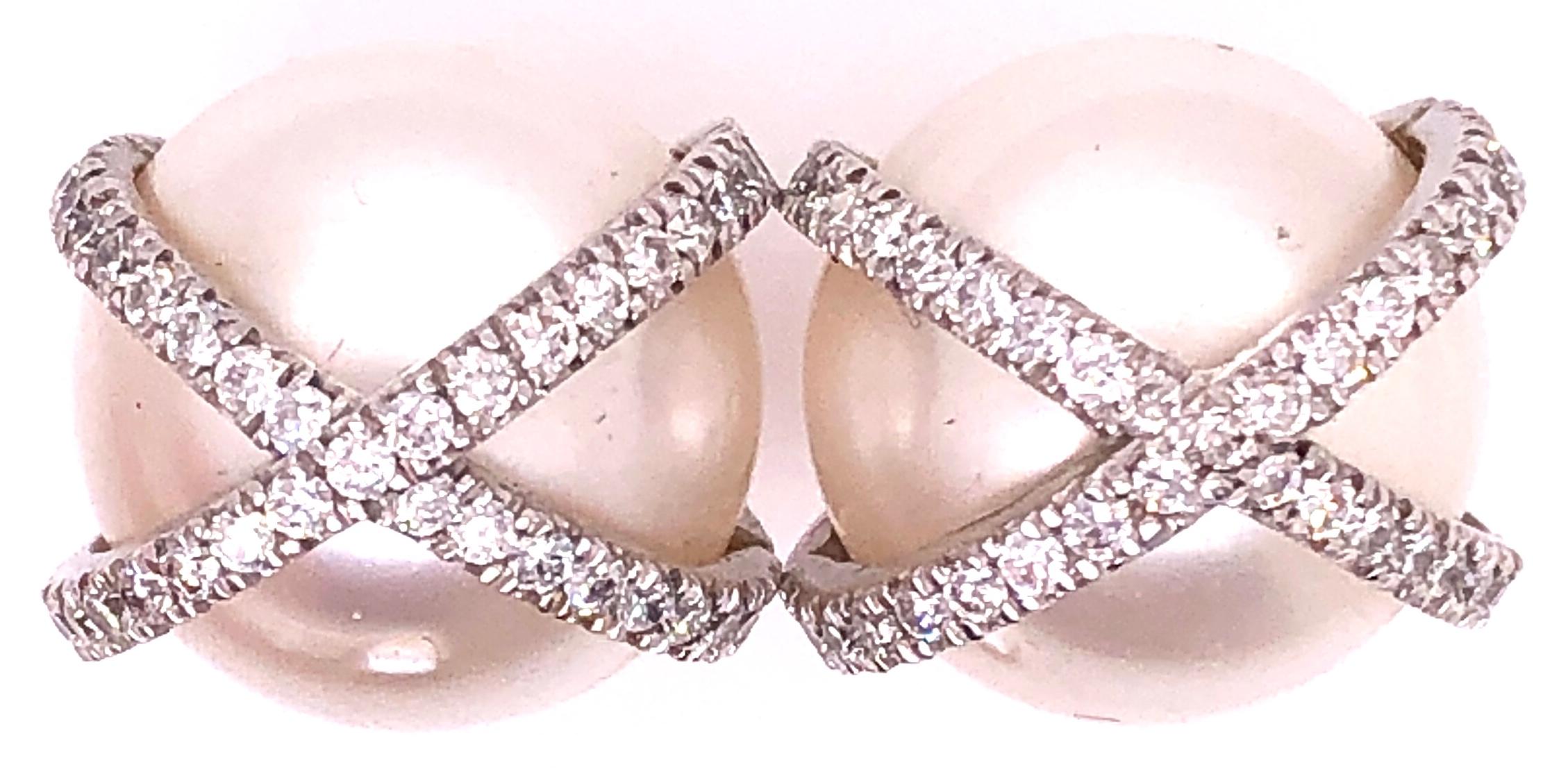 A Large and Impressive pair of 18 Karat White Gold Wrapped Pearl & Diamond Earrings. This Stunning pair of Baroque 14.25mm cultured pearls wrapped in gold and diamonds weighs 13.1 grams. Marked Mecan 750 PA AL also bearing another hallmark. The pair