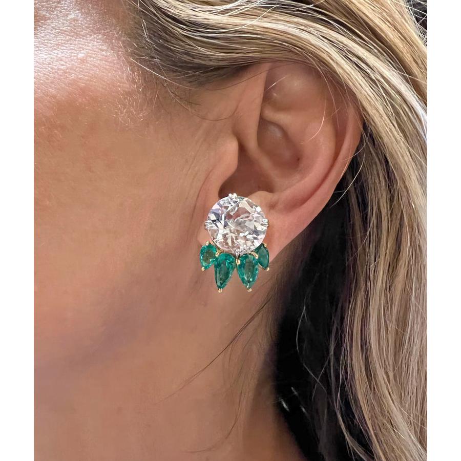 White topaz and emerald cluster earrings, handmade in 18k yellow gold and platinum settings. Two round white topaz weighing 25.79 total carats. Eight pear-shaped emeralds weighing 4.95 total carats. Clip backs (posts may be added upon request).