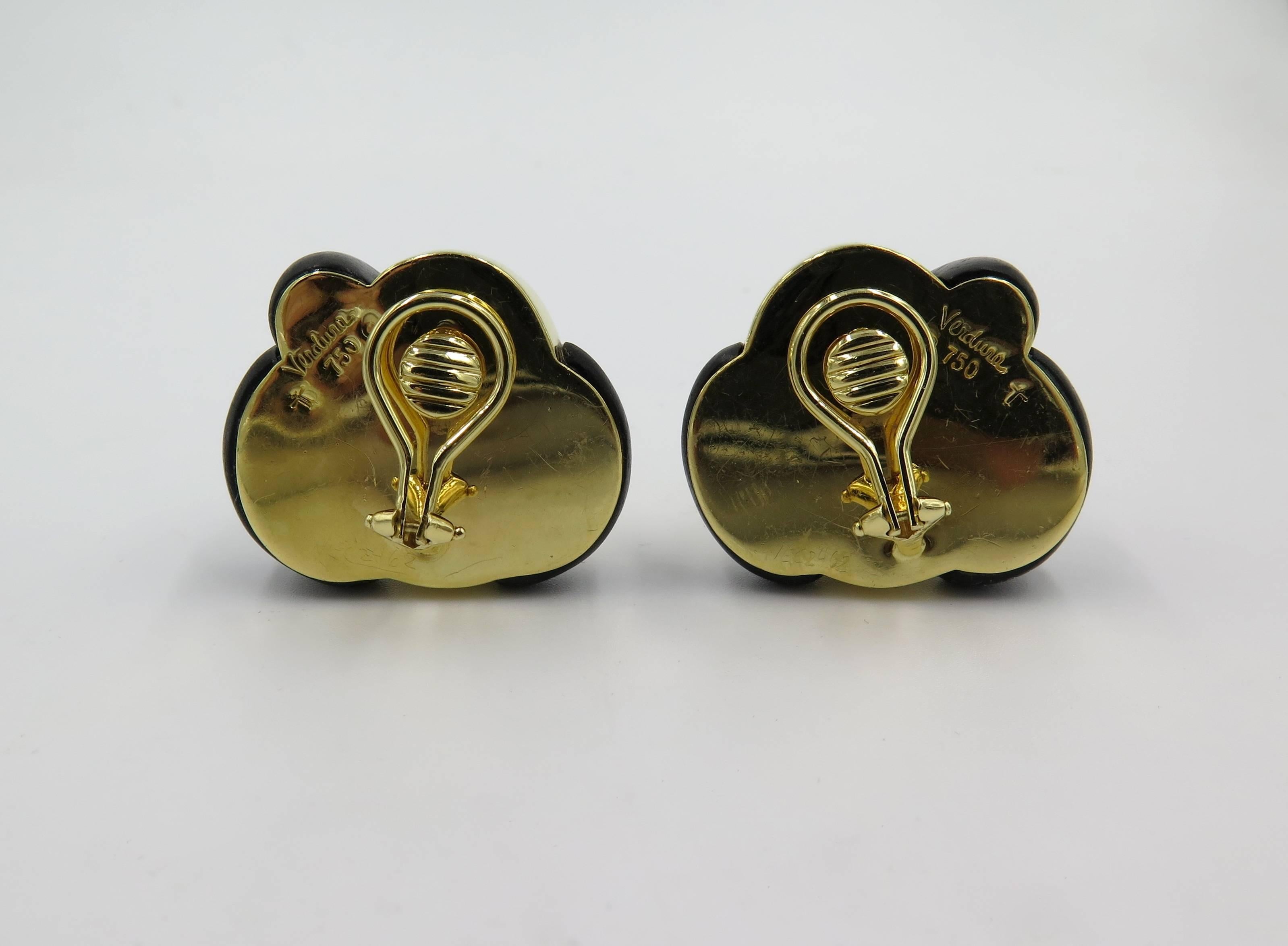 A pair of 18 karat yellow gold and wood earrings. Verdura. Designed as dark wood and polished gold knots. Length is approximately 1 inch. Gross weight is approximately 34.7 grams. 