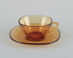 Vereco, France. A set of three coffee cups with saucers in amber glass.