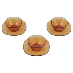 Retro Vereco, France. A set of three coffee cups with saucers in amber glass. 