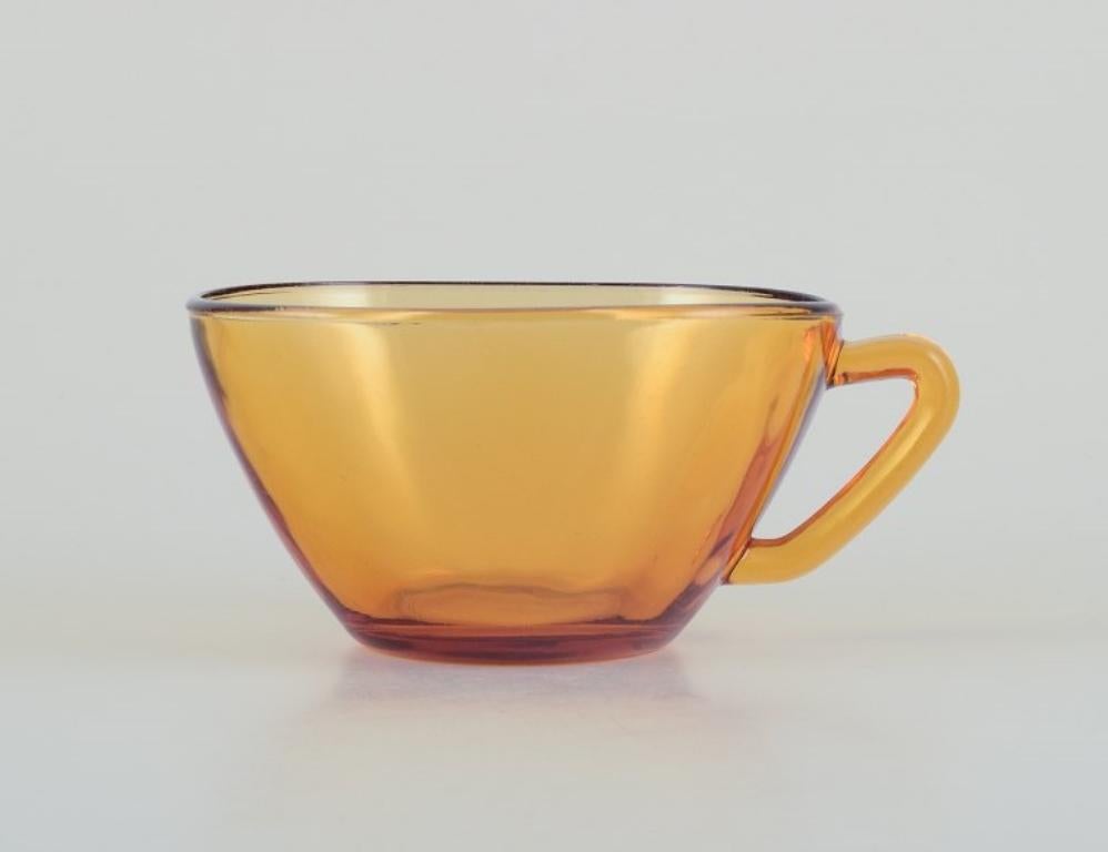 French Vereco, France. Six-person tea set in amber glass. Modernist design. For Sale