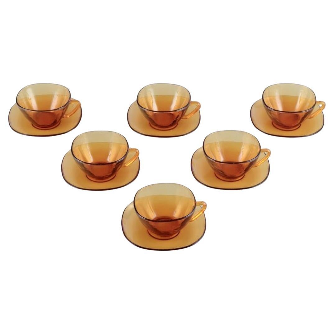 Vereco, France. Six-person tea set in amber glass. Modernist design.  For Sale