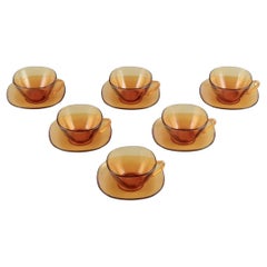 Used Vereco, France. Six-person tea set in amber glass. Modernist design. 