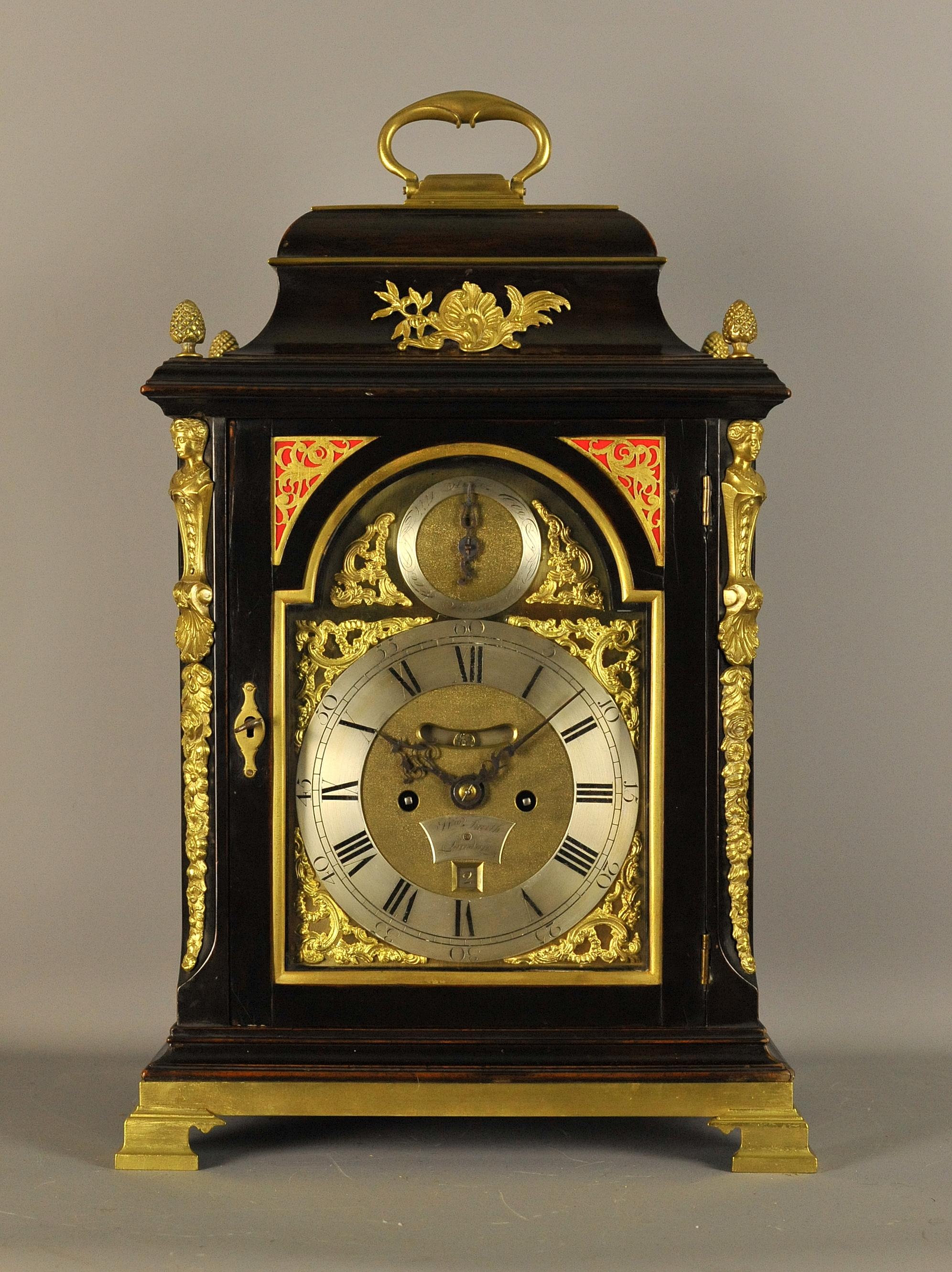 This is a very fine and impressive gilt brass mounted verge bracket clock by William Smith of London circa 1760
The double fusee movement retains its original verge escapement and has a beautifully engraved back plate depicting oriental scenes. It