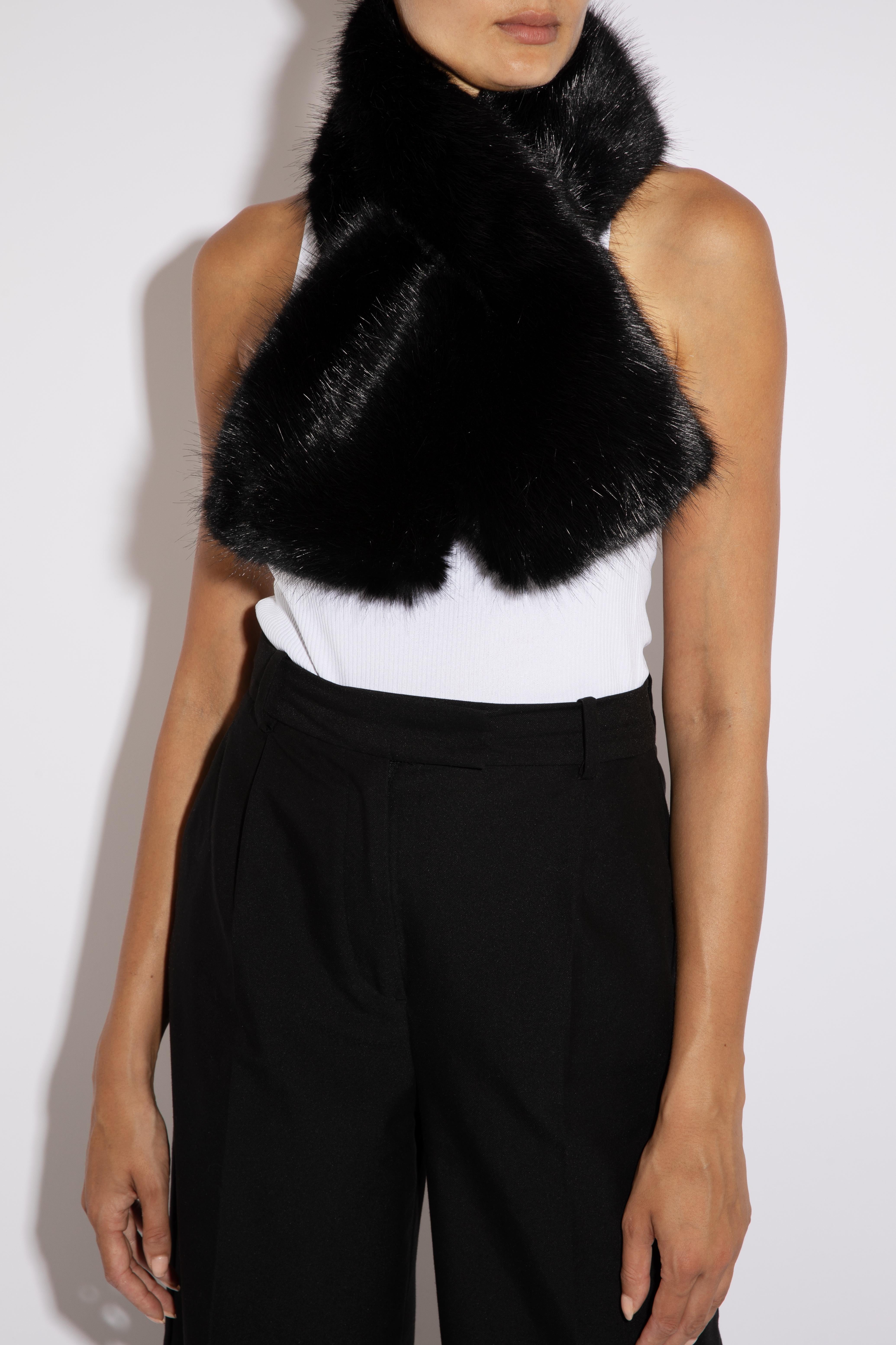 Cross-through Faux Fur Collar in Black

Details and Care:
Colour: Black
Luxurious Faux Fur
lined in 100% Acetate Satin
Special dry clean

Size and Fit:
Size fits all
Ties with hook and eyes