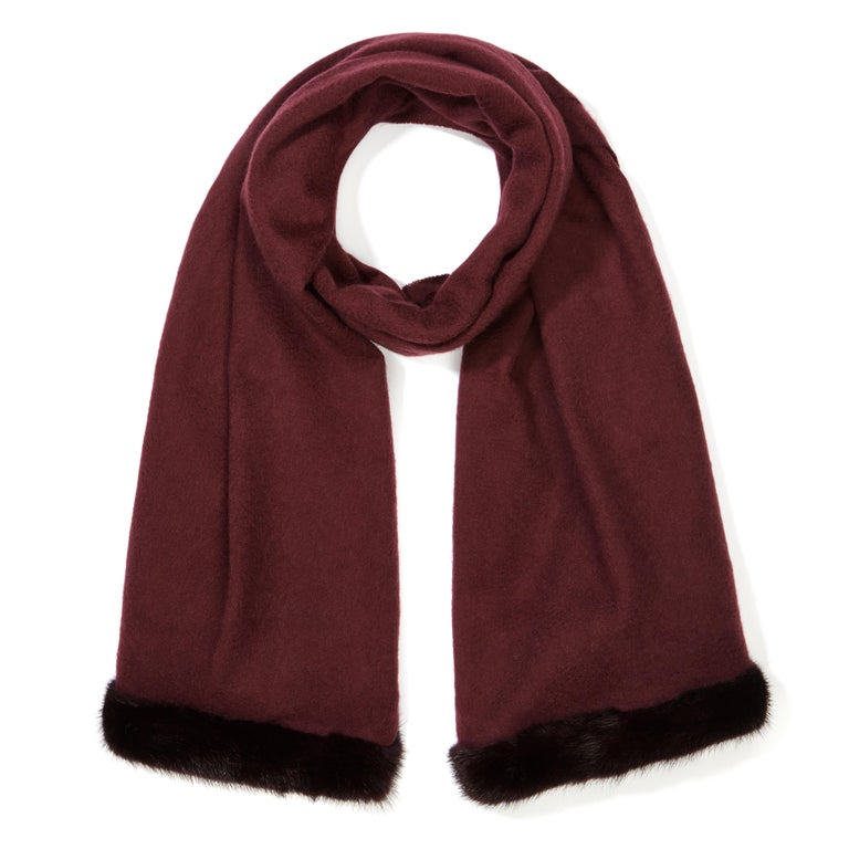 Verheyen London Mink Fur Trimmed Cashmere Shawl Scarf in Rich Burgundy 

Verheyen London’s shawl is spun from the finest Scottish woven cashmere and finished with the most exquisite dyed mink. Its warmth envelopes you with luxury, perfect for travel