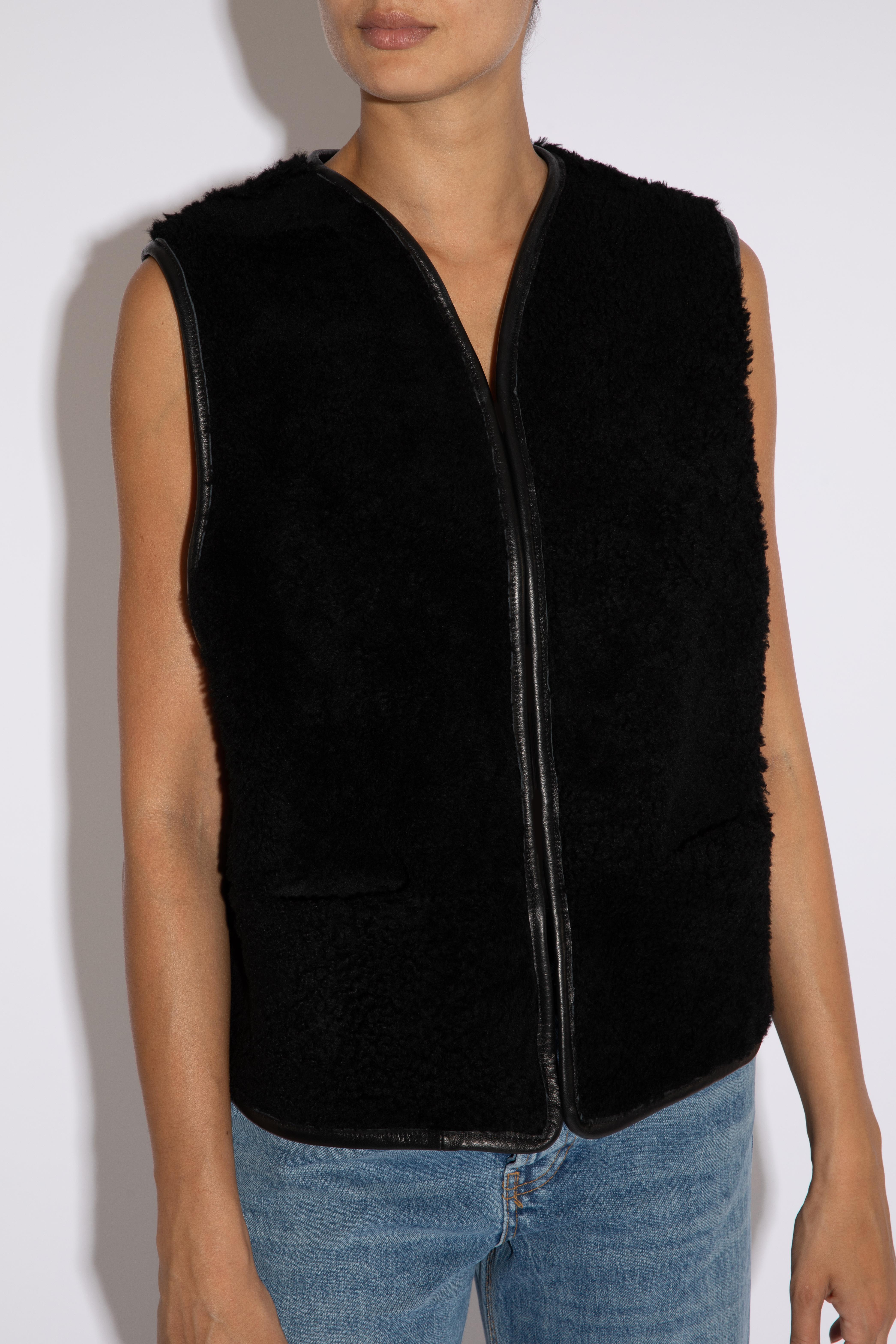 Verheyen London Reversible Shearling Gilet in Black - Size large

Handmade in London, made with lamb merino shearling this luxury item is an investment piece to wear for a lifetime.  One side is leather and one side is merino shearling. Ideal for