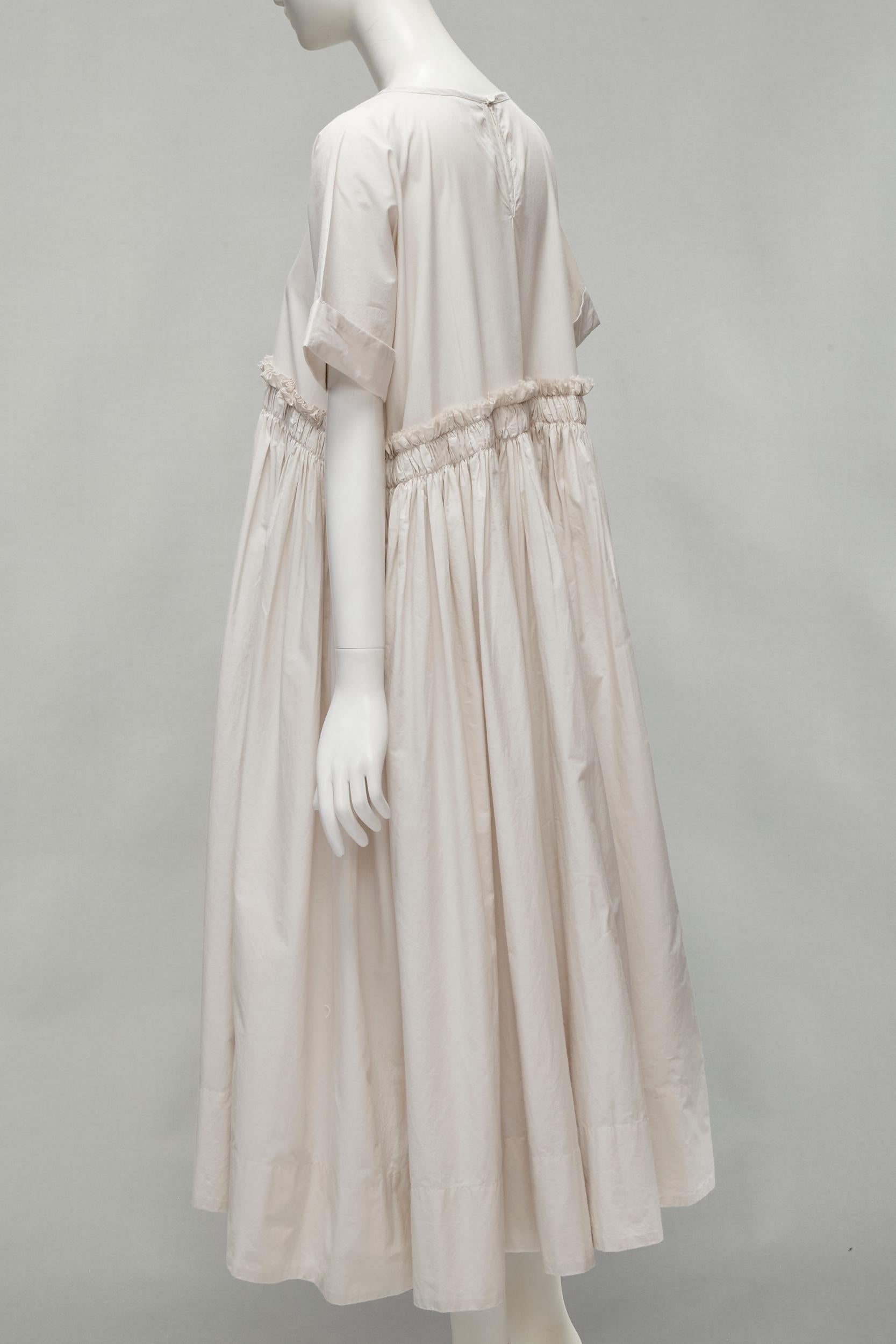 VERITECOEUR cotton stone grey gather waist rolled sleeve round neck flared dress For Sale 1