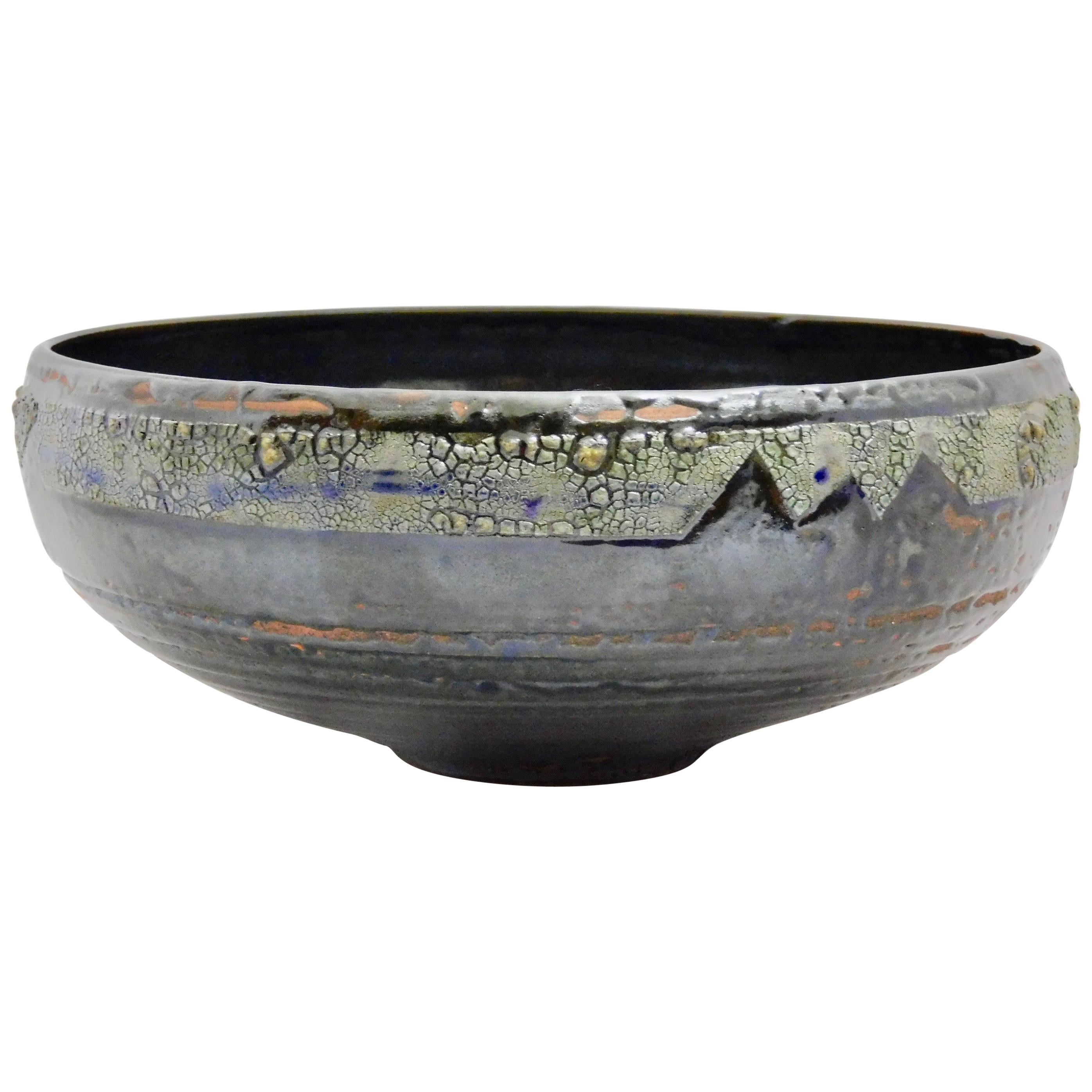 Verkovina wheel thrown earthenware bowl by ceramicist Andrew Wilder.
This is a one of a kind object made in the ancient way- by hand in a small artisanal pottery. In this series Wilder explores the application of lichen under glazes to achieve