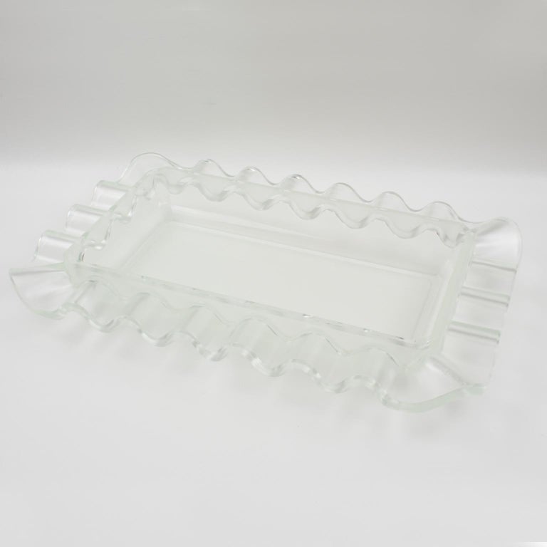 This impressive sculptural Art Deco frosted centerpiece bowl was designed by Verlys, France. A large-scale glass bowl with geometric waved design in a frosted and clear pattern, produced by Les Verreries d'Art Verlys & des Hanots - S.A. Holophane,