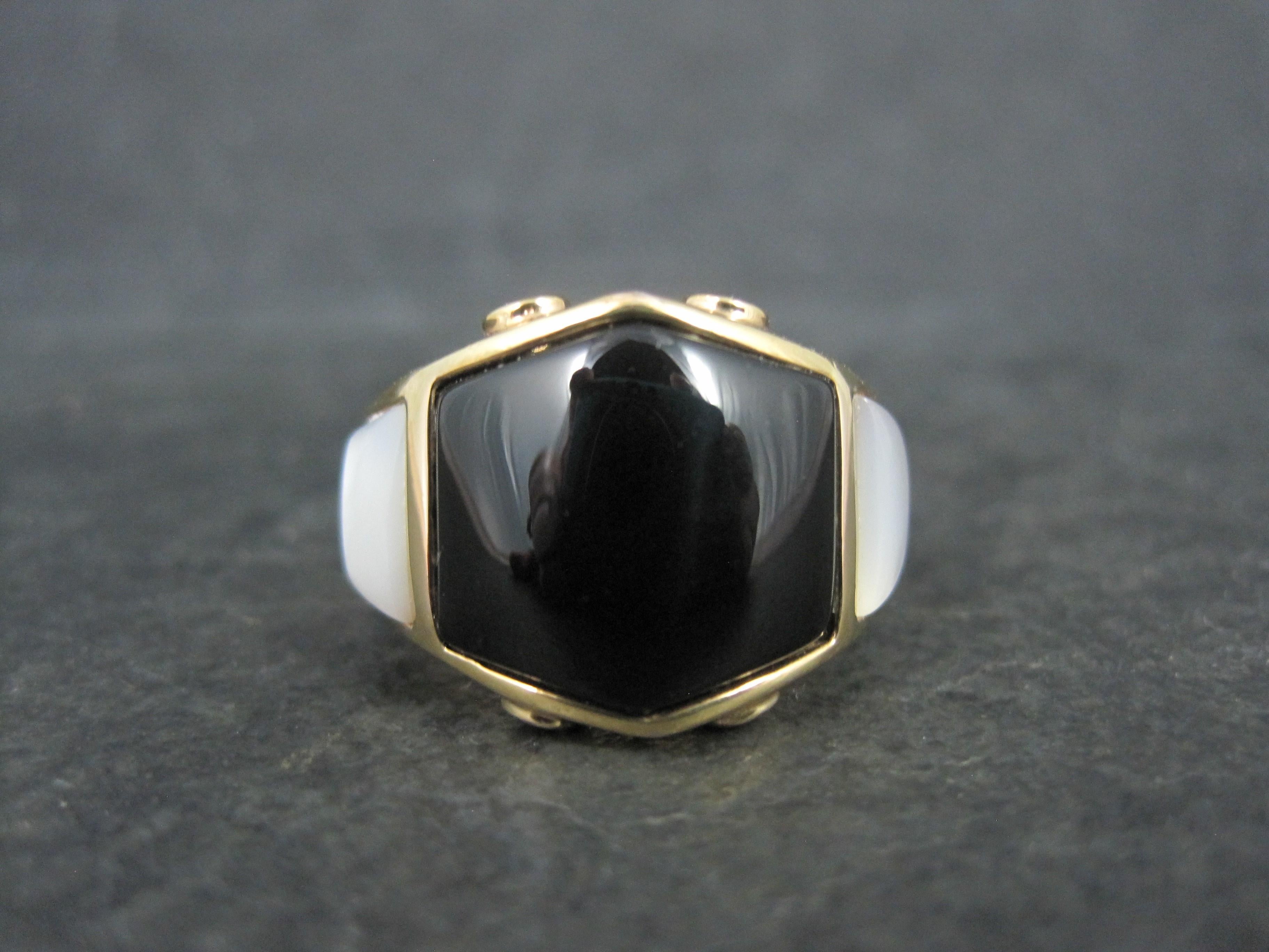 This beautiful estate ring is gold vermeil over sterling silver.
It features inlaid onyx and mother of pearl with cubic zirconia accents.

The face of this ring measures 9/16 of an inch north to south.
Size: 8
Marks: China, 925

Condition: Excellent