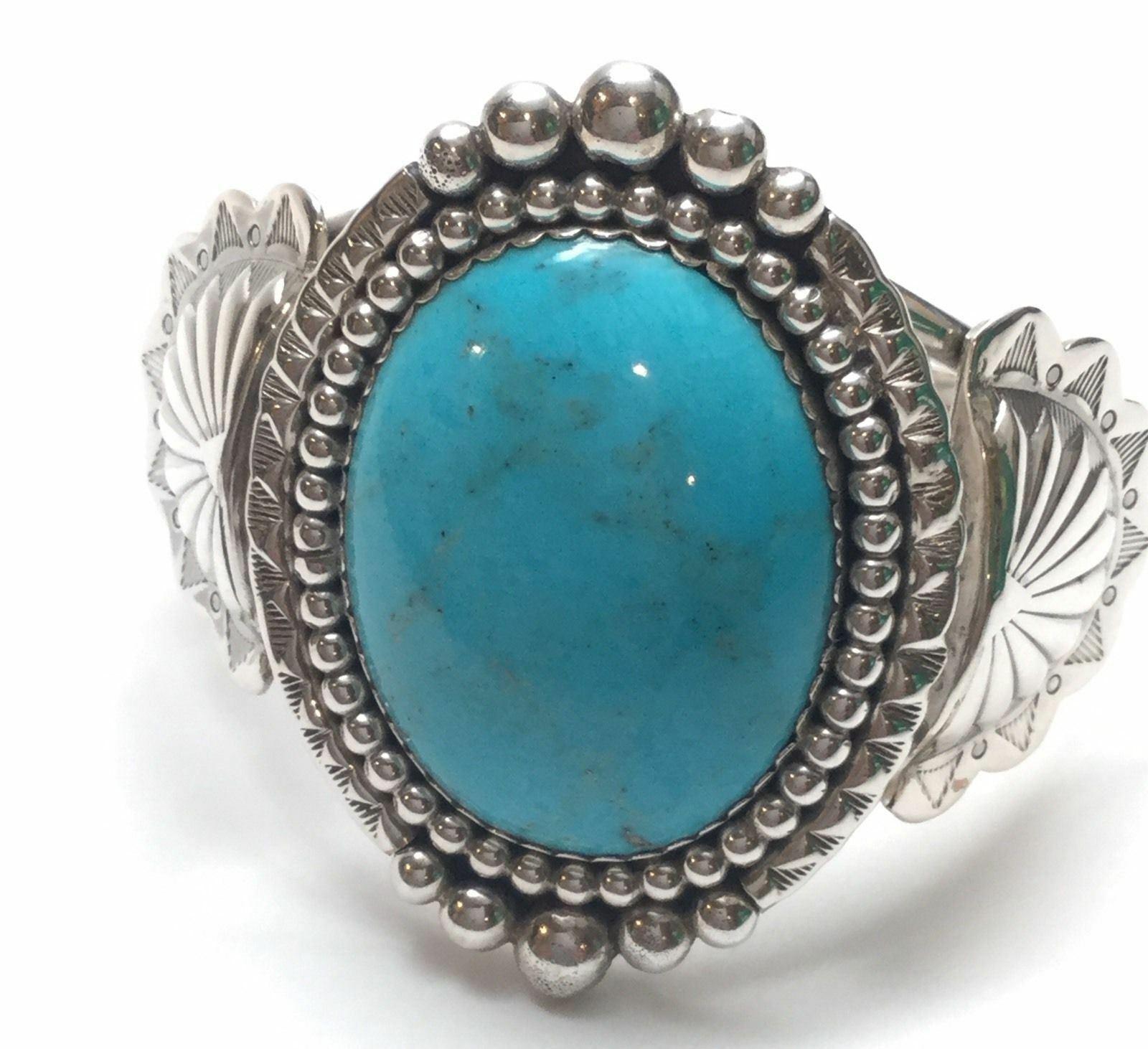 Verna Blackgoat Navajo Native American sterling silver turquoise cuff bracelet.

Marked: V.BLACKGOAT, Sterling, crooked arrow - hallmark.

Measures: 5 5/8