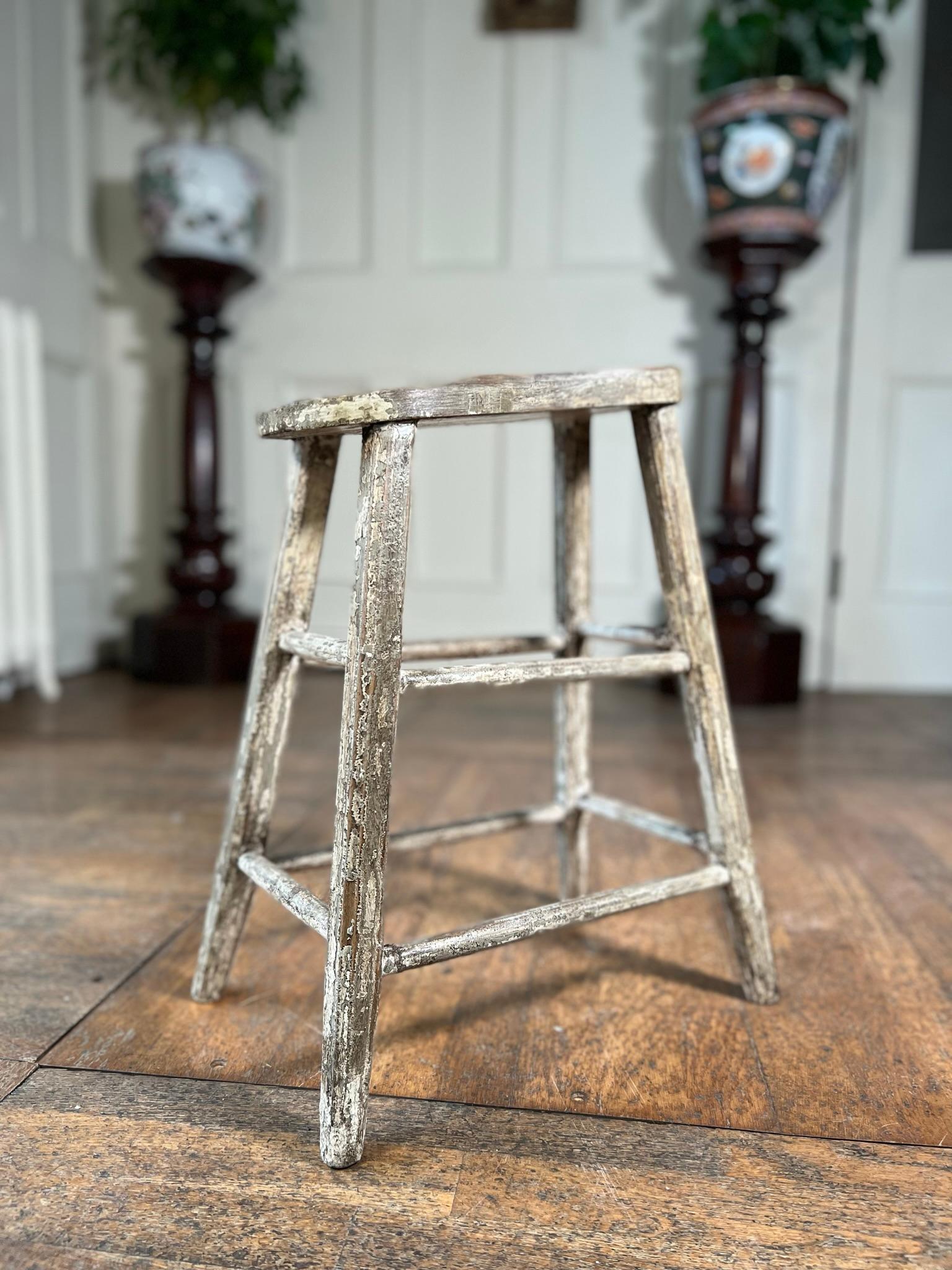 Small vernacular stool used for lacing up boots.

Probably originally used for riding boots.

Nails in the top for grip.

A nice 19th century vernacular piece in a good used condition.

Measurements: 50cm h x 40cm w x 26cm d 
(Measurements taken at