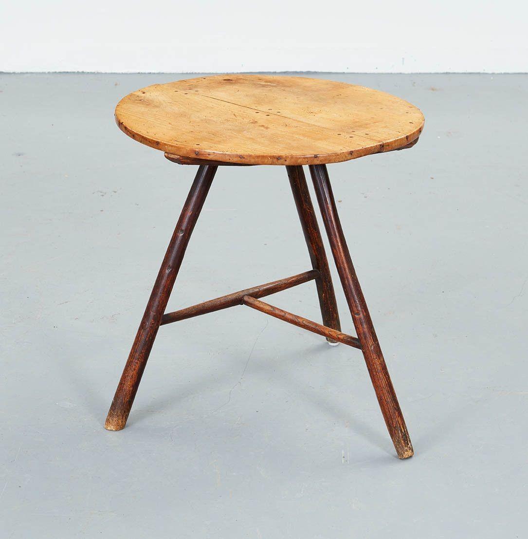 A vernacular cricket table having an attractive sycamore top over three turned rustic ash legs joined by a T-stretcher. A useful piece as a drinks, lamp or occasional table.