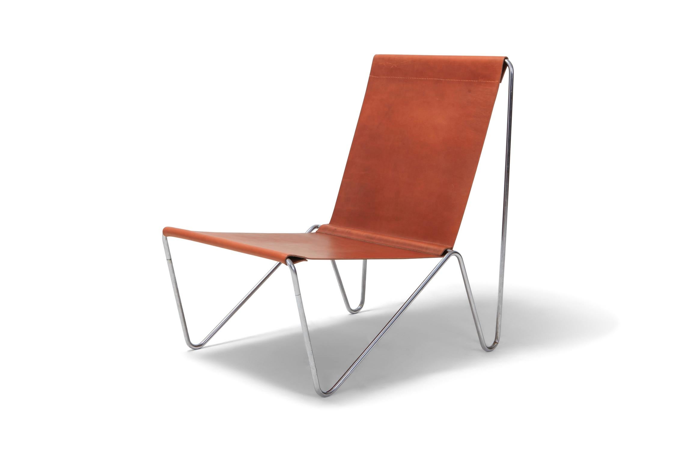Fritz Hansen manufactured easy chair by Verner Panton.

A minimal tubular steel frame with suspended cognac leather.

Verner's first world famous design.

Model 3350
Manufactured by Fritz Hansen. 

Denmark, 1953.
 
