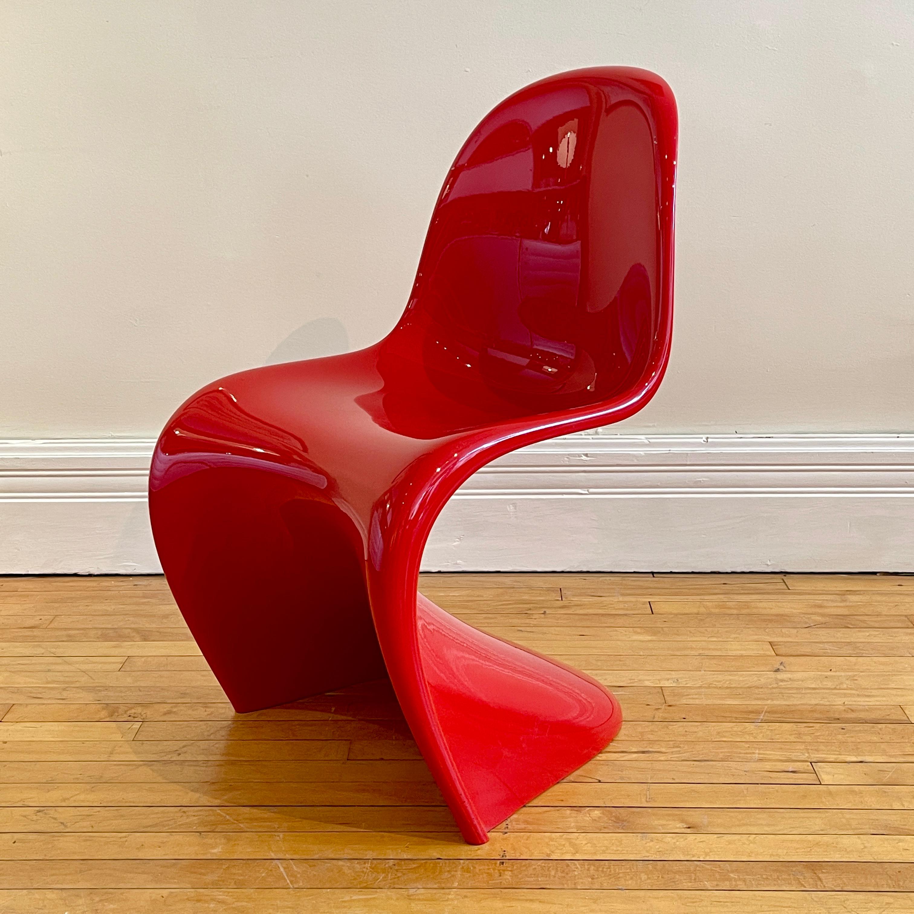 This is a really great set Verner PANTON CLASSIC chairs made by Vitra. 

From Vitra:
The history of the Panton Chair dates back to the latter half of the 1950s, when Danish designer Verner Panton developed the idea of a plastic cantilever chair.