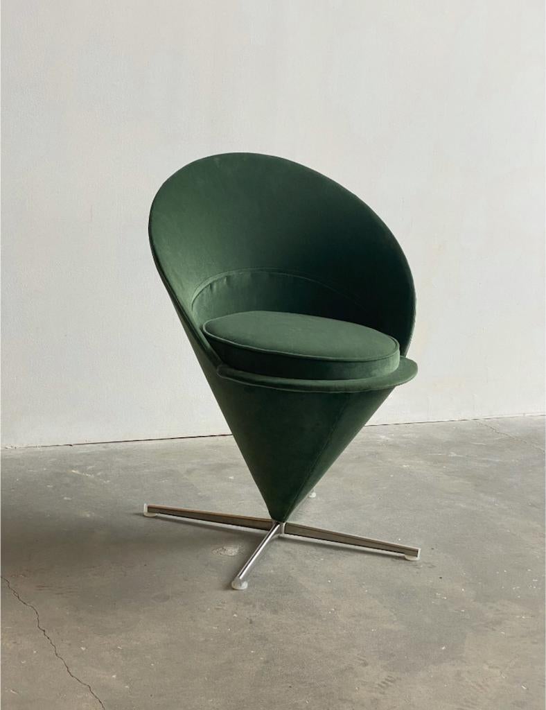 A Verner Panton “Cone” chair manufactured by Vitra, upholstered in luxurious forrest green velvet. The chair maintains its original tags.