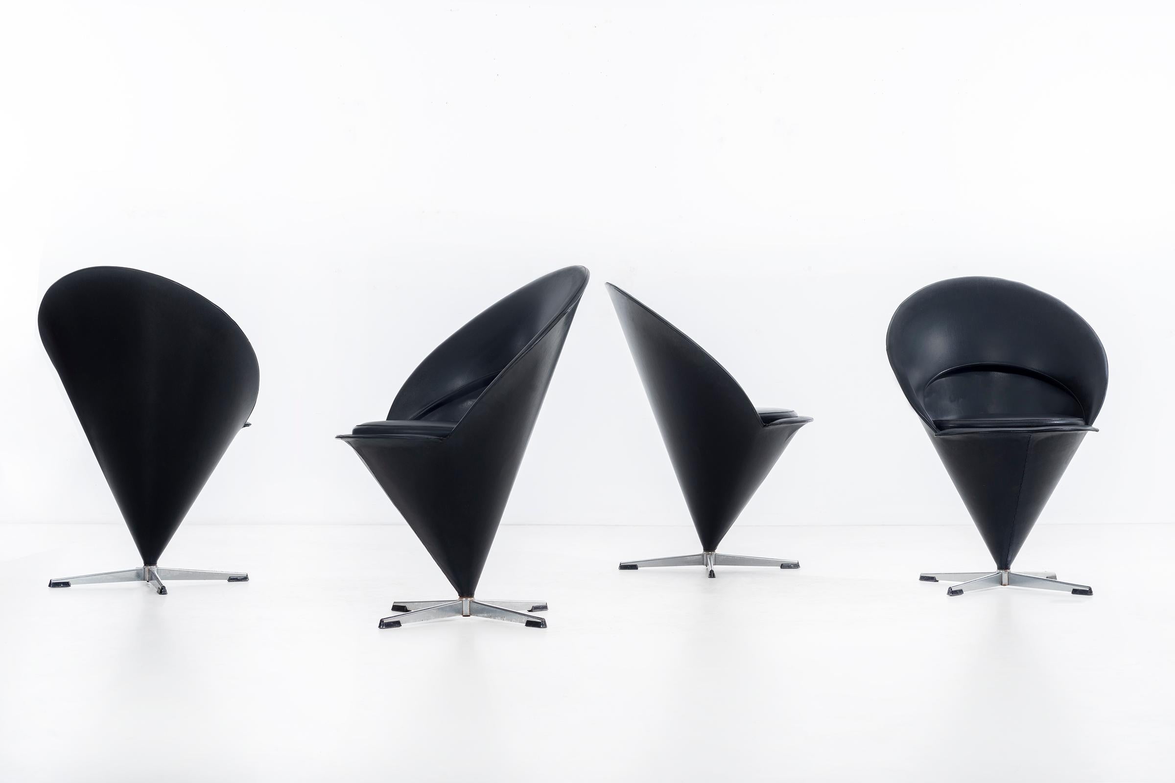 Verner Panton Cone chairs, set of 4 original black vinyl with black leather seats.
Manufacturers Frem Røjle stamped underside of seats.