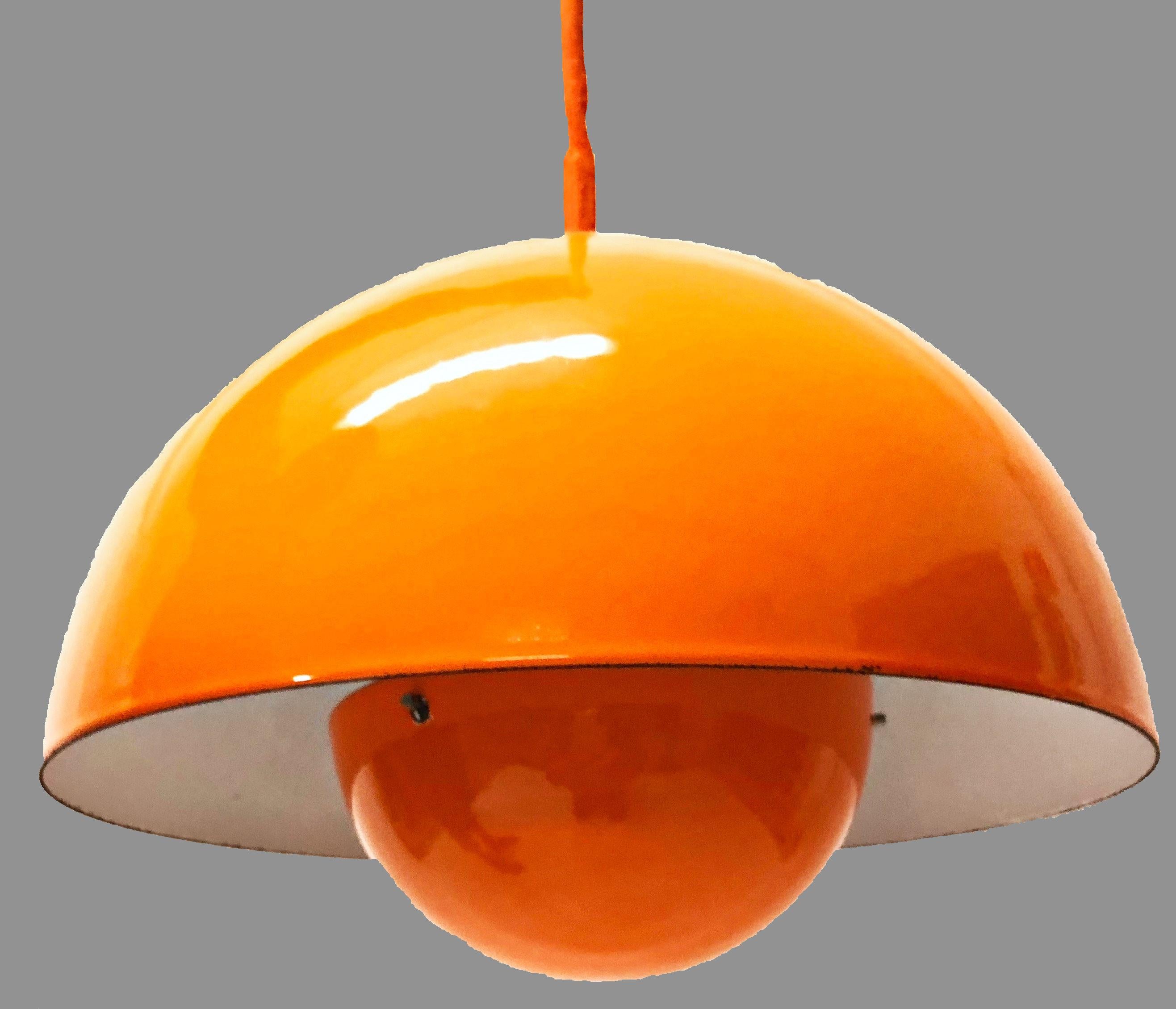 Verner Panton flowerpot pendant light designed for Louis Poulsen in 1969.

This pendant is an early example of the Panton flowerpot model and feature an orange enamel lampshade consisting of two semi-circular spheres facing each other.

The