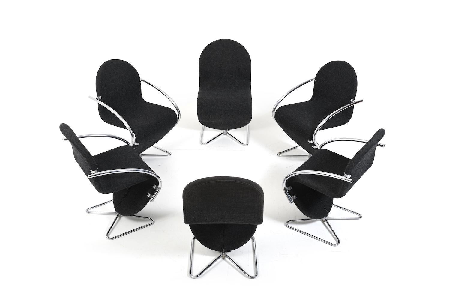 Set of six Verner Panton swivel chairs for Fritz Hansen 1973. Series 1-2-3, produced by Fritz Hansen Denmark 1978. Model with butterfly base. Four chairs with chromed armrests. Covered in dark grey Divina/ Kvadrat fabric. 2 chairs with the label.