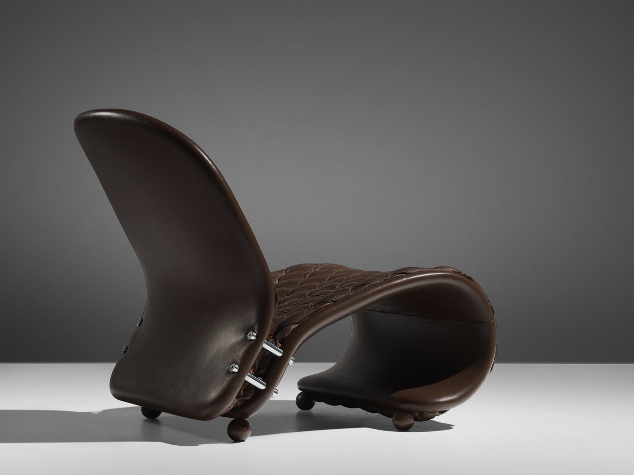 Verner Panton for Fritz Hansen, easy chair 'Model G', in brown leather, Denmark, 1973. 

'Model G' chair from the 1-2-3 system in dark brown tufted leather. This lounge chair features a distinctive shape. This icon is designed by Verner Panton in