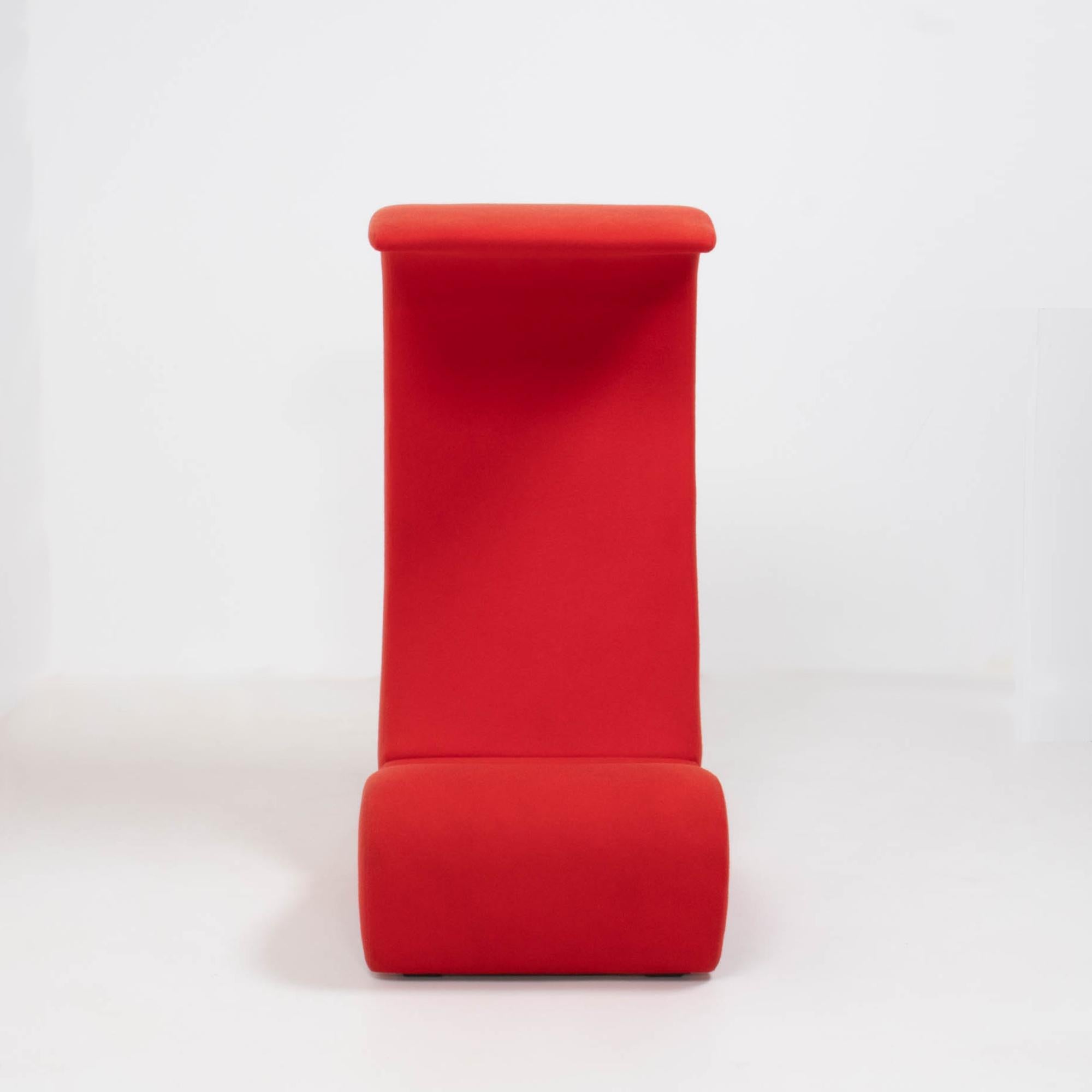 Originally designed by Verner Panton in 1970, the Amoebe Highback chair was created for the Visiona installation and has become a design icon.

Upholstered in bright red fabric, the sinuous curves create a bold and sculptural silhouette which also