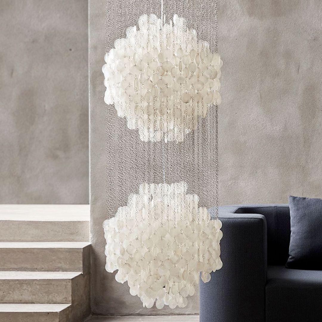 Verner Panton 'Fun 5DM' chandelier lamp in sea shells and wood for Verpan.

Verner Panton was one of Denmark's most legendary modern furniture and interior designers. His innovative experimentation with new materials, bold shapes and vibrant colors