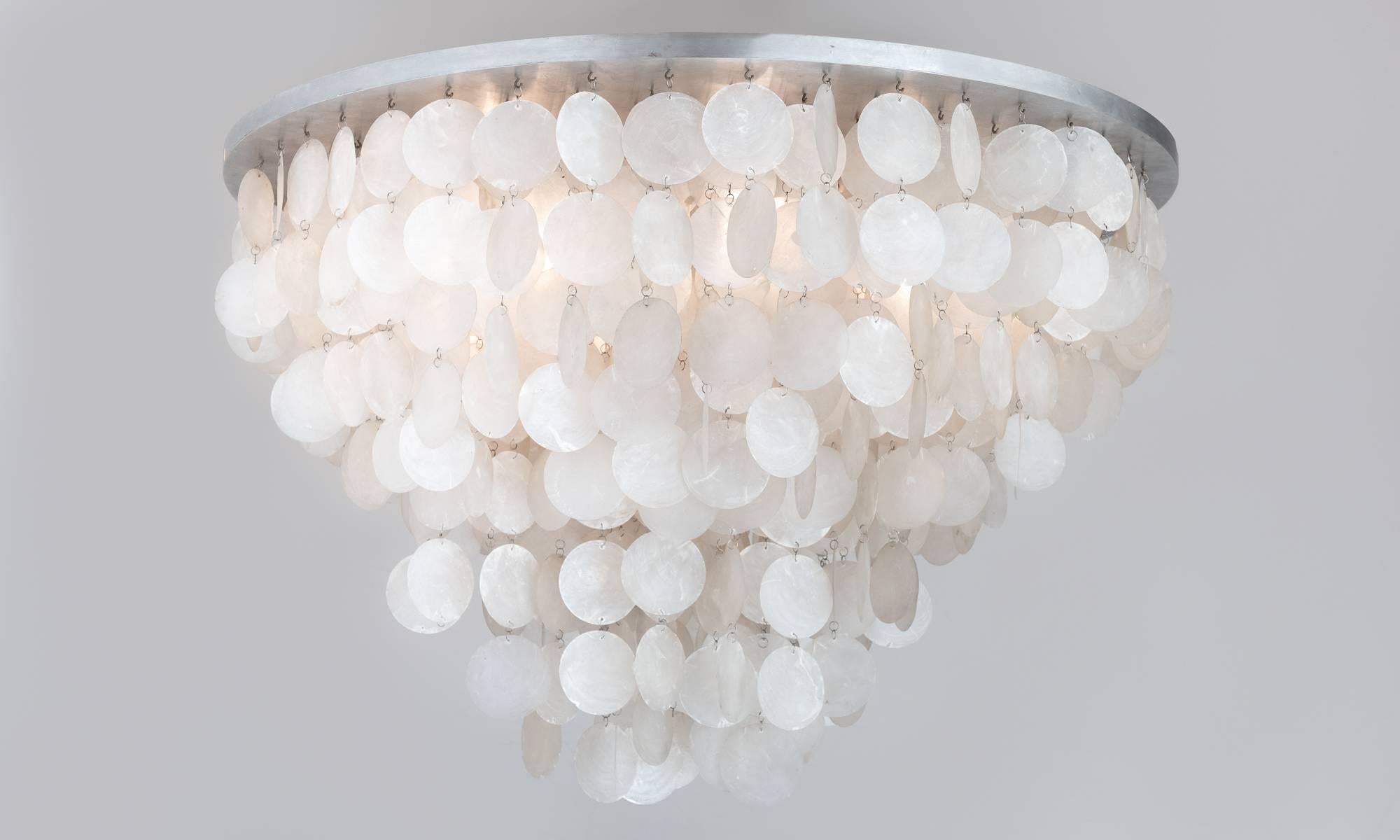 Verner Panton Fun Series Chandelier.

Suspended mother-of-pearl discs create an elegant form designed by Verner Panton and made by Luber.

35