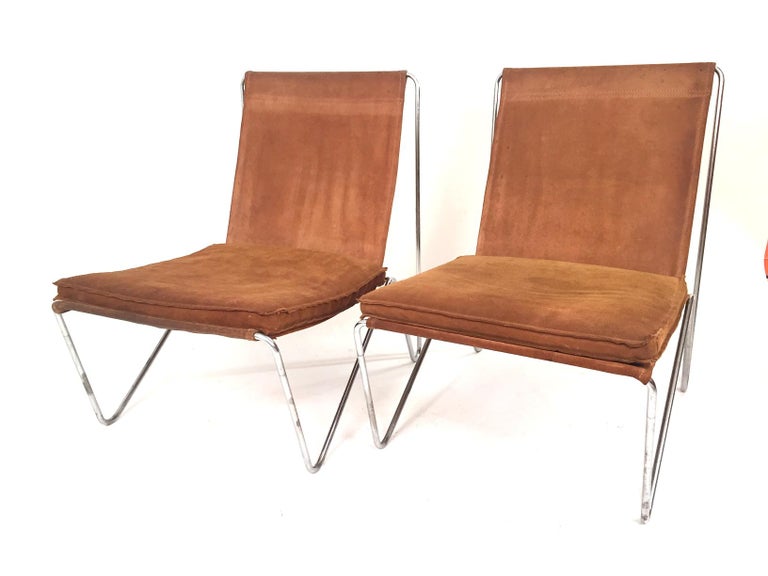 An outstanding pair of bachelor chairs. Iron base and suede leather. Designer Verner Panton. Outstanding.