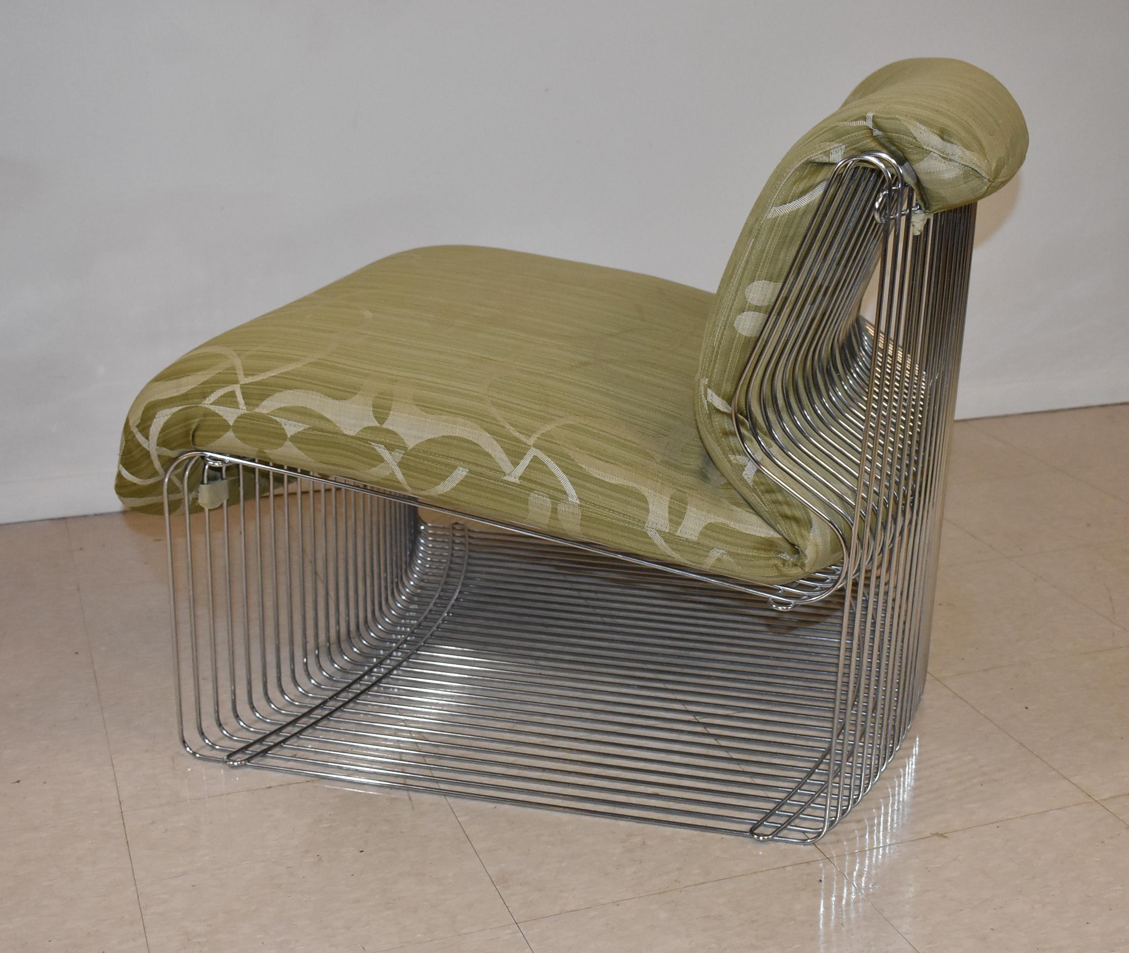 This Pantonova lounge chair was designed by Verner Panton in 1971. This chair features parallel chromed steel wire rods with open sides. The upholstery is believed to be original. The chair measures at 28