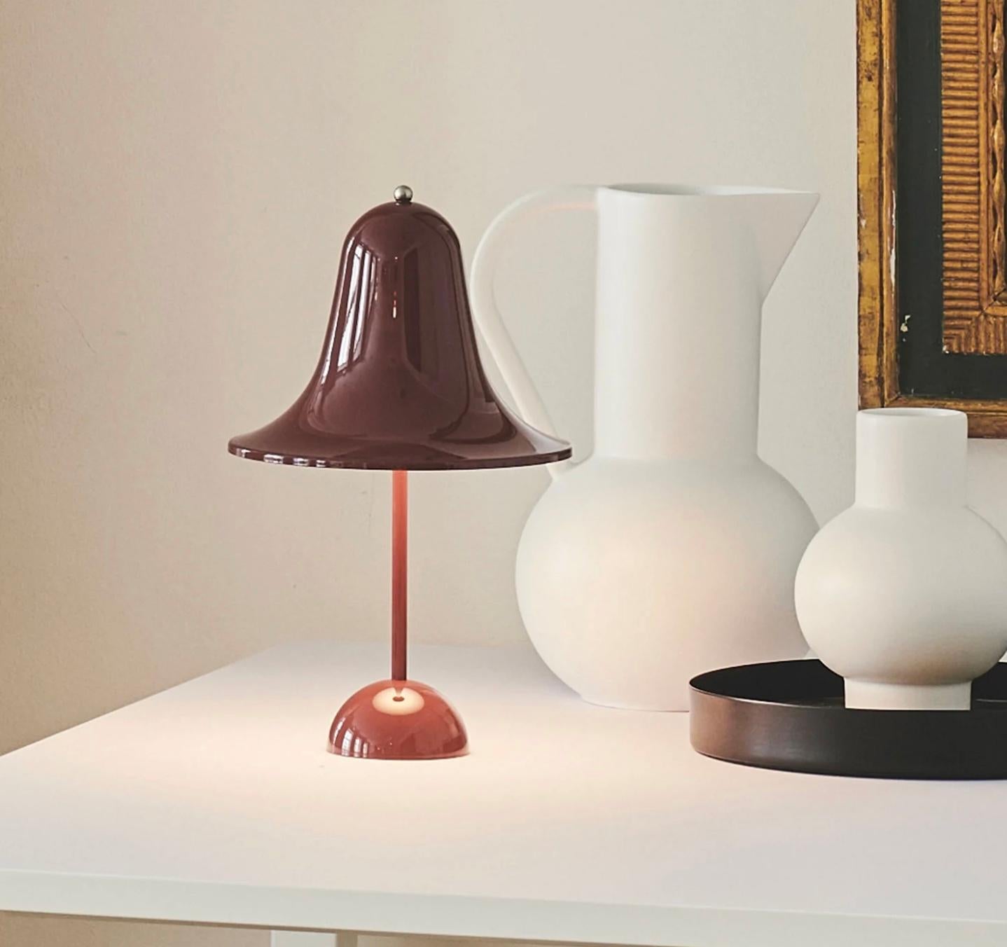 Verner Panton 'Pantop Portable' table lamp in 'Burgundy' for Verpan. Designed in 1980. New, current production.

This is a versatile smaller and wireless version of the 'Pantop' table lamp, usb-chargeable. 

The elegant Pantop line was designed