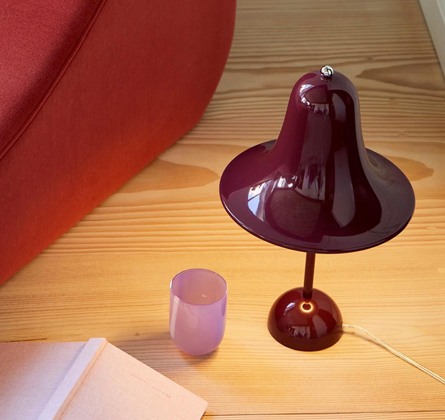 Verner Panton 'Pantop' table lamp in 'Burgundy' for Verpan. Designed in 1980. New, current production.

The elegant Pantop line was designed by Verner Panton in 1980, and has for a long time been a staple of the Verpan collection. Pantop is