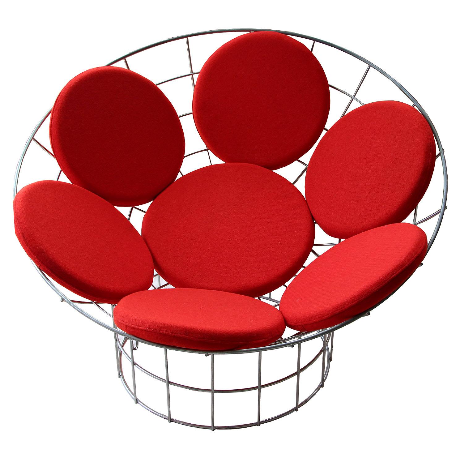 The original Peacock chair is very unique and visually amazing!, assembled with clips. The structure has two metal pieces, one in a bowl shaped and a cylindrical base made of galvanised stainless steel. The seat has seven removable red seat cushions