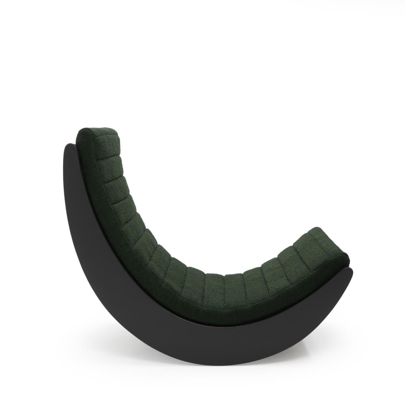 Relaxer II rocking chair designed by Verner Panton, produced by Rosenthal, Germany during the 1970s.

The rocking chair consists of a black lacquered wooden curved structure with a fabric cushion attached. We have re-upholstered the cushion with a