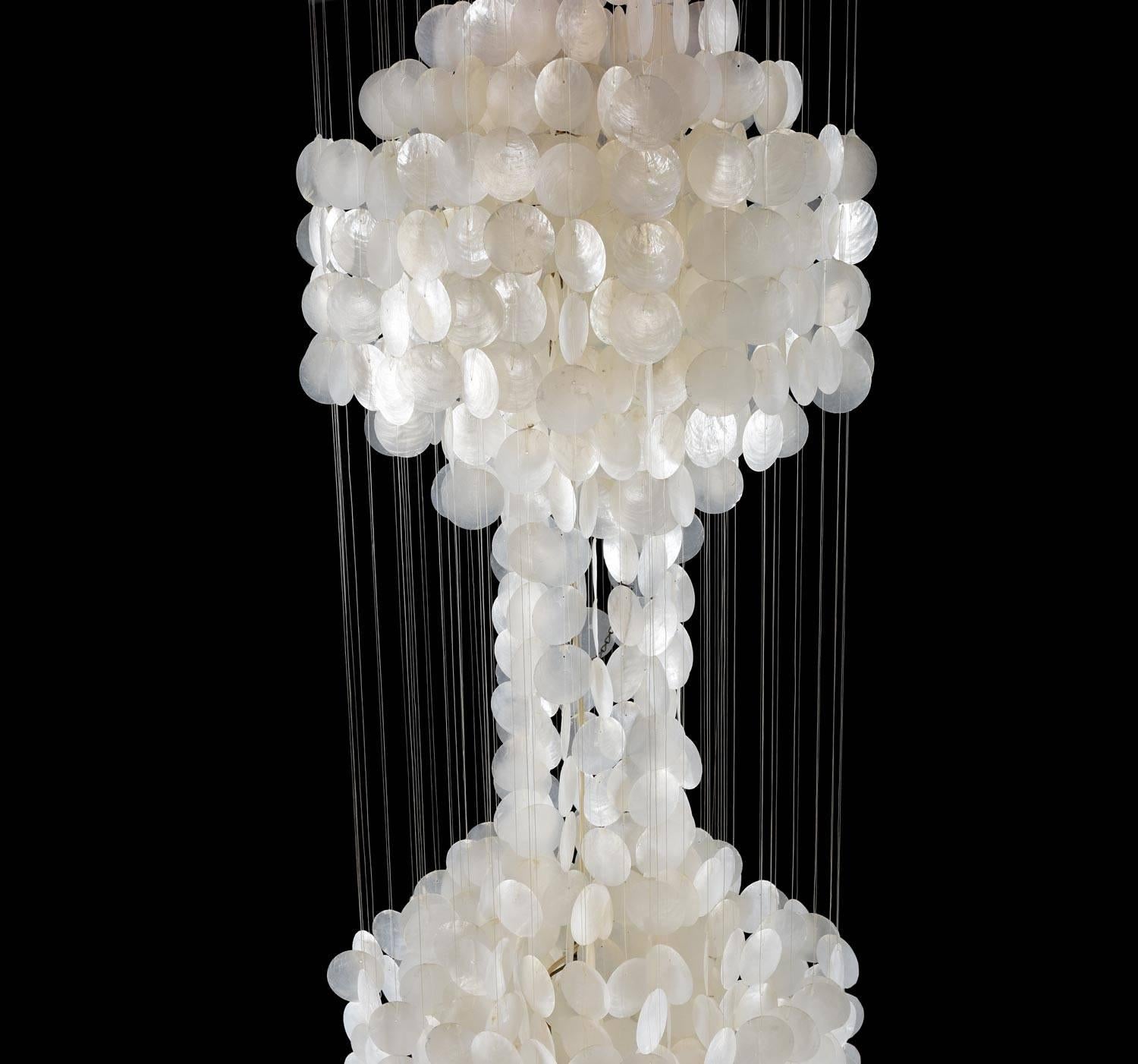Breathtaking huge capiz shell hanging chandelier. 7 feet tall! Ethereal light is diffused from three points. A statement piece that will make a lasting impression. Imagine this cascading from a stairwell or vaulted ceiling. Pure magic!

The top