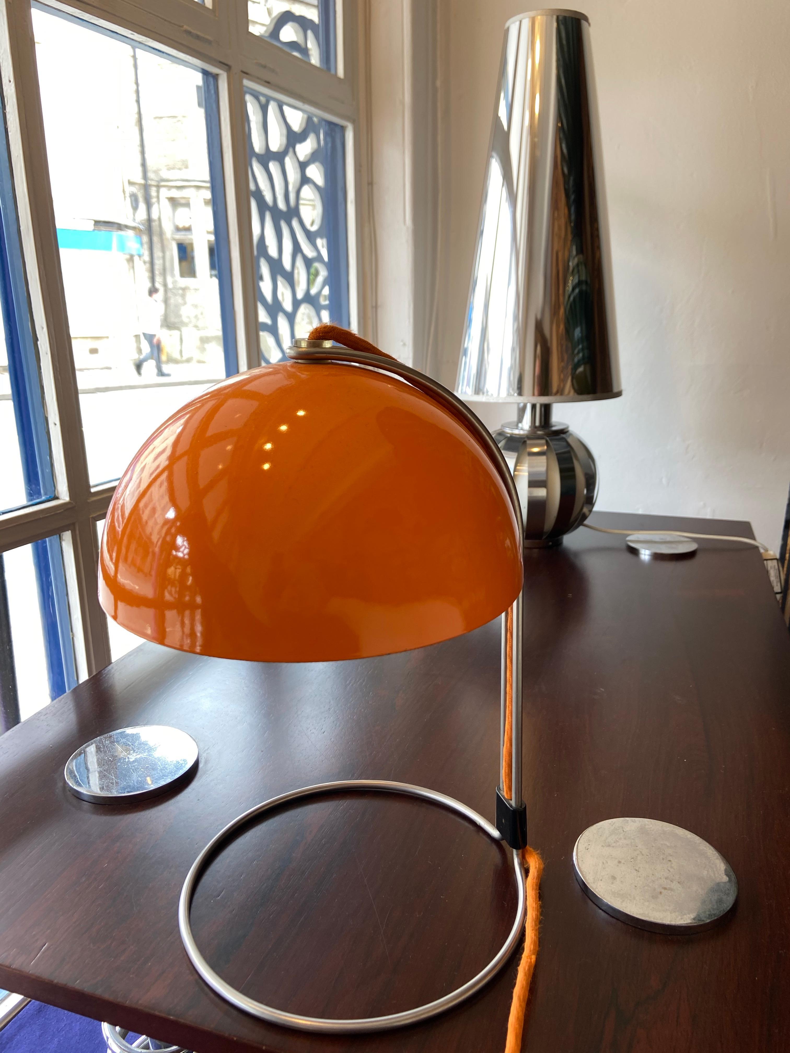 Unusual and stunning Verner Panton space age flowerpot lamp, circa 1969. 

Rare orange stove enamelled by Louis Poulsen, Denmark. Gives off a beautiful warm glow when lit.
It has the original light switch and flex.

Measures 34cm high.