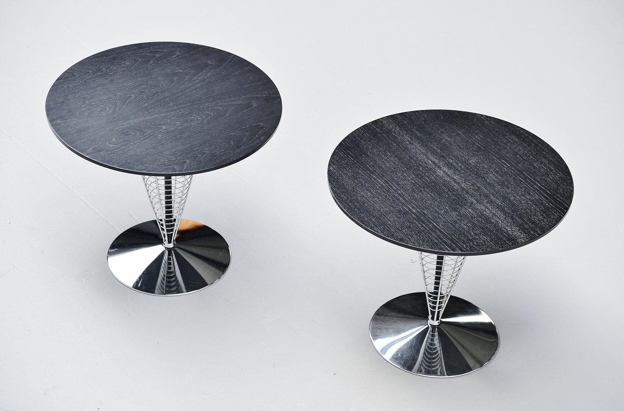 Nice and rare ‘wire cone’ tables designed by Verner Panton and manufactured by Fritz Hansen, Denmark, 1988. These tables have chrome plated metal wire frames and black stained wooden tops. These tables are model 8820 from the very first production