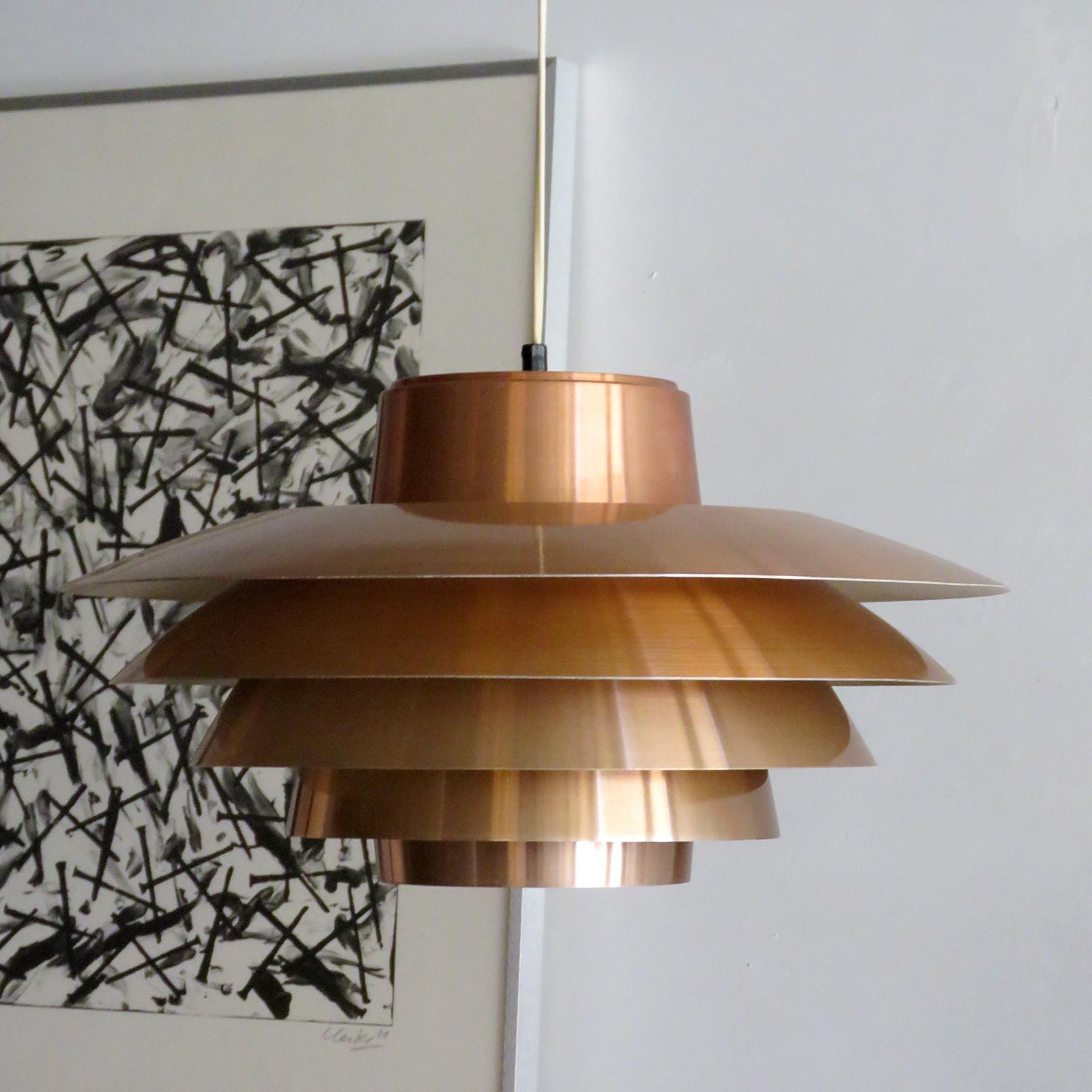 Wonderful tiered 'Verona' pendant, designed by Sven Middleboe for Nordisk Solar Compagni in Denmark in 1962. This five louvered copper pendant is perfect for above a dining table, providing a nice soft diffused light, marked. One E26 socket, max.