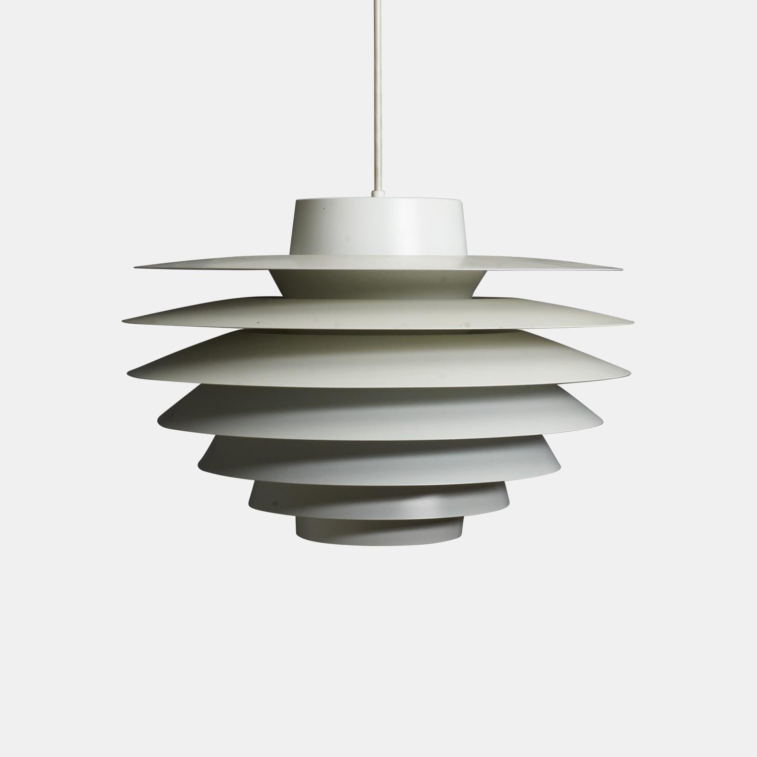 A “Verona” hanging lamp by Svend Middleboe for Nordisk Solar. White lacquered metal shades and new white plastic cord.