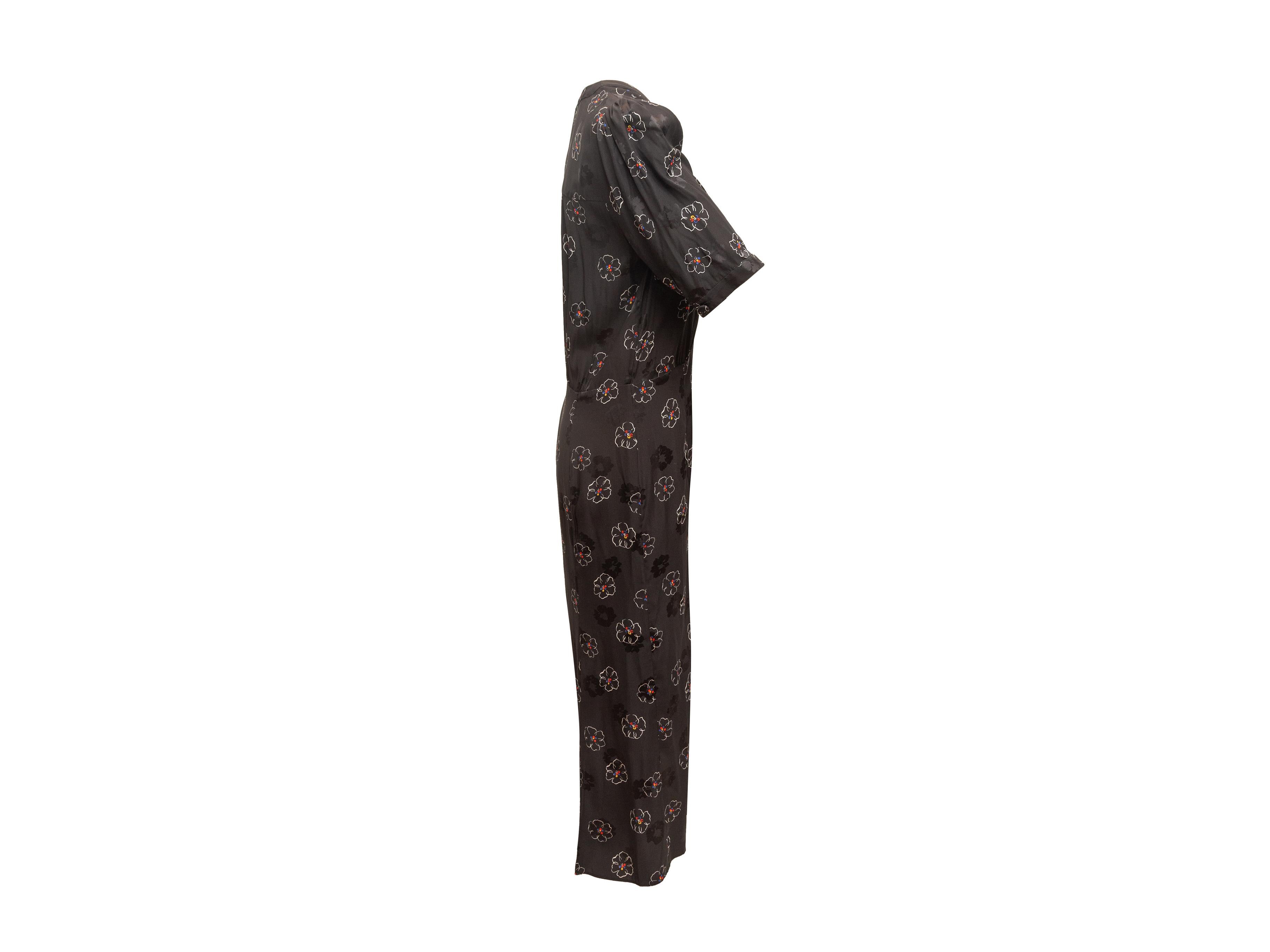 Product details: Black and multicolor silk floral print maxi dress by Veronica Beard. Surplice neckline. Short sleeves. Button closures at front. 40