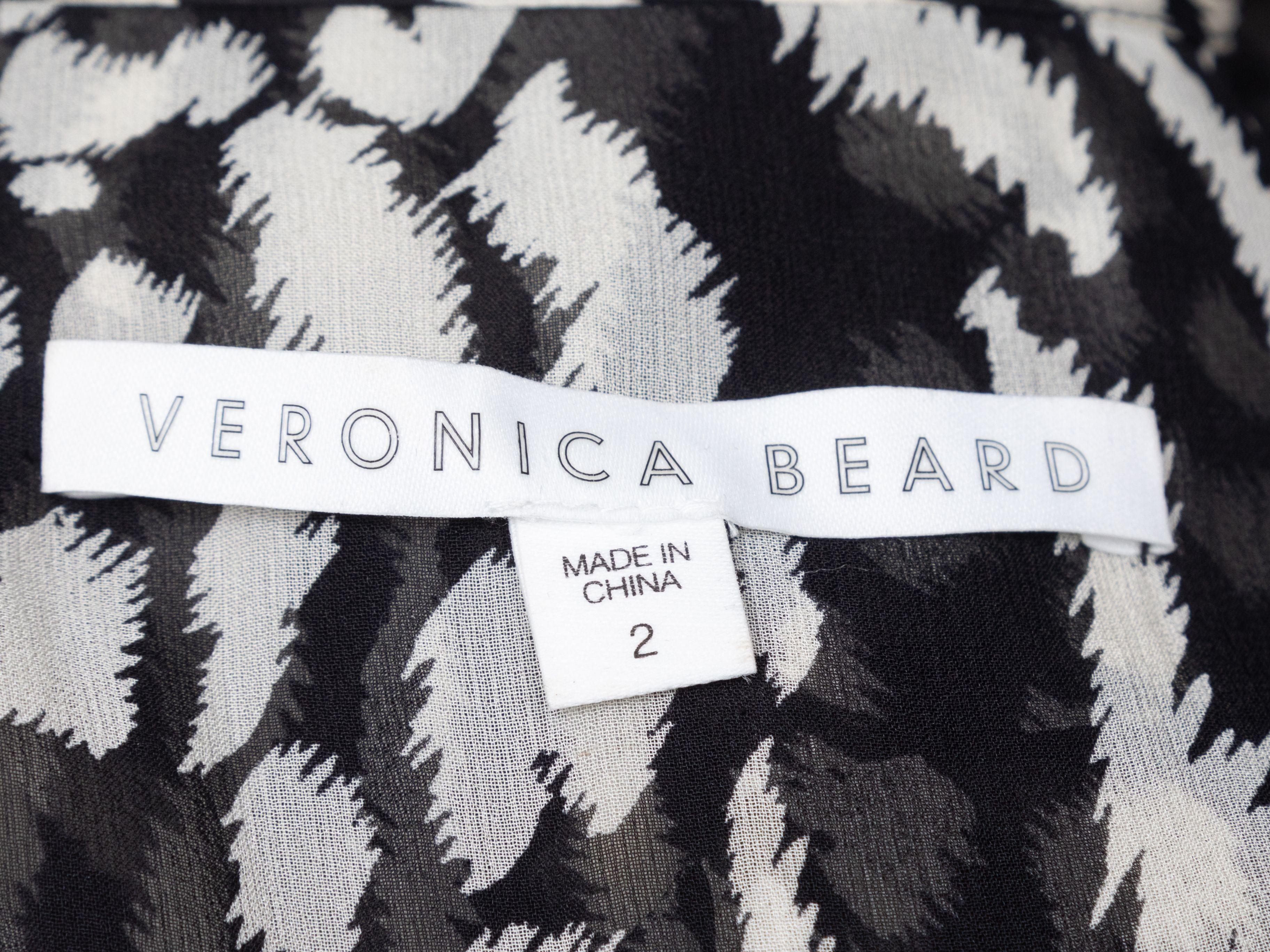 Product Details: Black and white abstract print wrap mini dress by Veronica Beard. V-neck. Long sleeves. Designer size 2. 44