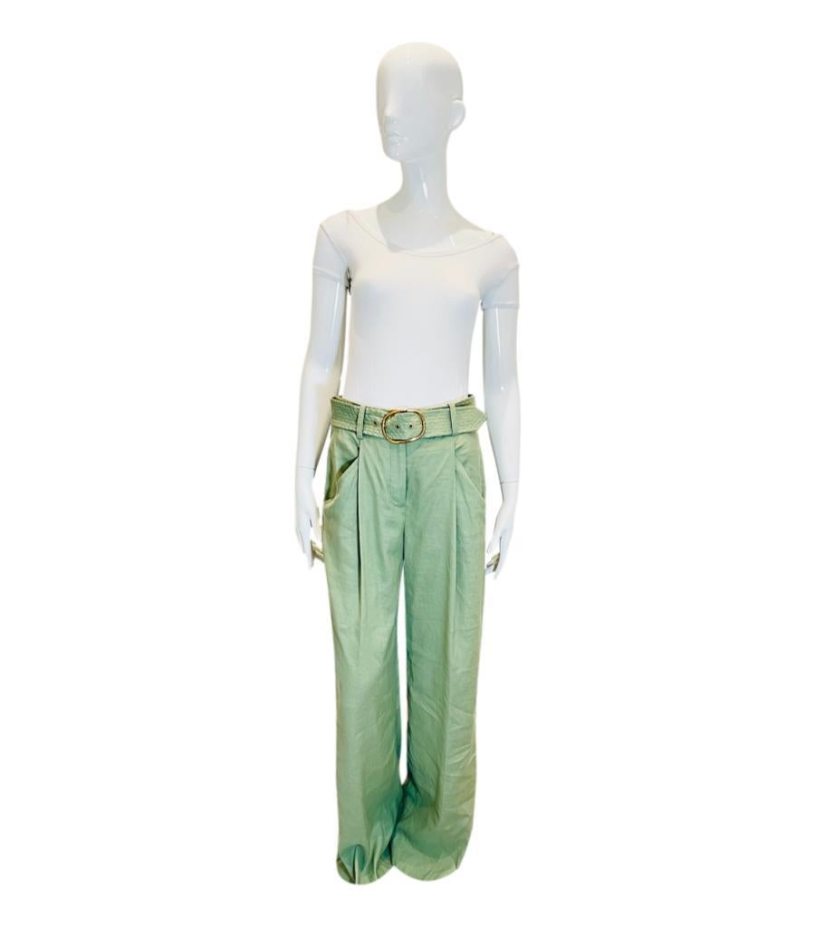Veronica Beard Linen & Tencel Blend Palazzo Trousers
Washed sage 'Rimini' trousers designed with gold buckle belted waist.
Featuring wide leg, pleated front and side slip pockets. Rrp £370
Size –  4US
Condition – Very Good (Brand new with labels,
