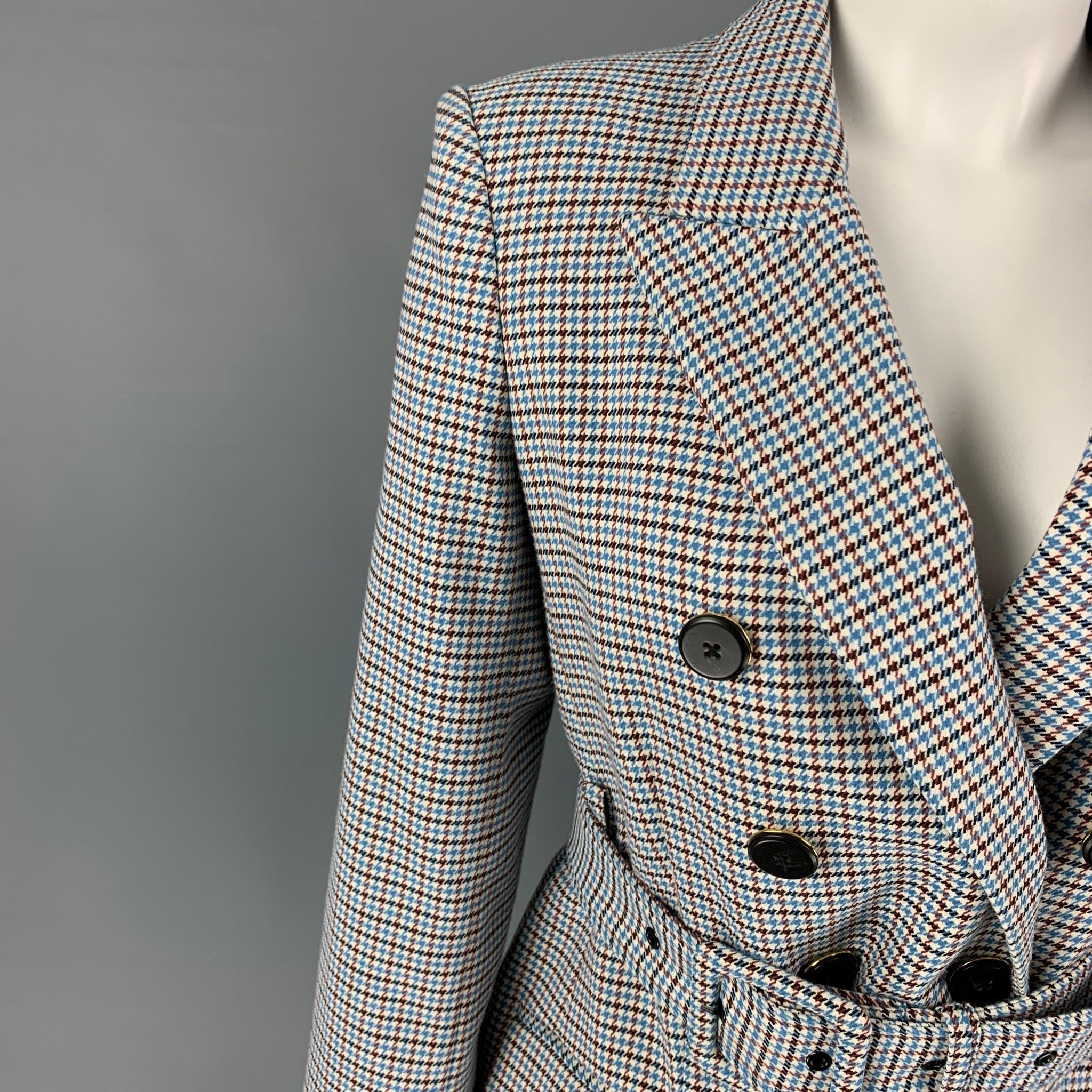 VERONICA BEARD jacket comes in a blue & cream houndstooth polyester blend with a full liner featuring a peak lapel, belted, flap pockets, single back vent, and a double breasted closure. Made in USA. 

Excellent Pre-Owned Condition.
Marked: