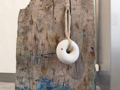 Driftwood, ship's patent, and a delicate piece of porcelain with gold.