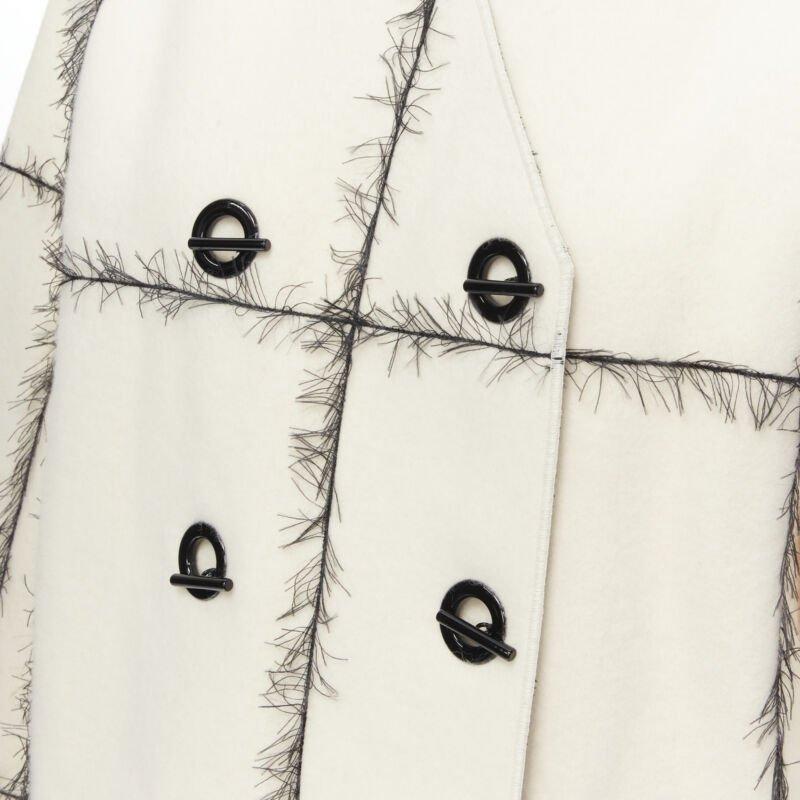 VERONIQUE LEROY cream wool frayed check toggle button double breasted coat FR36
Reference: MELK/A00004
Brand: Veronique Leroy
Material: Wool
Color: Cream, Black
Pattern: Checkered
Closure: Toggle
Extra Details: Double breasted toggle button. Dual
