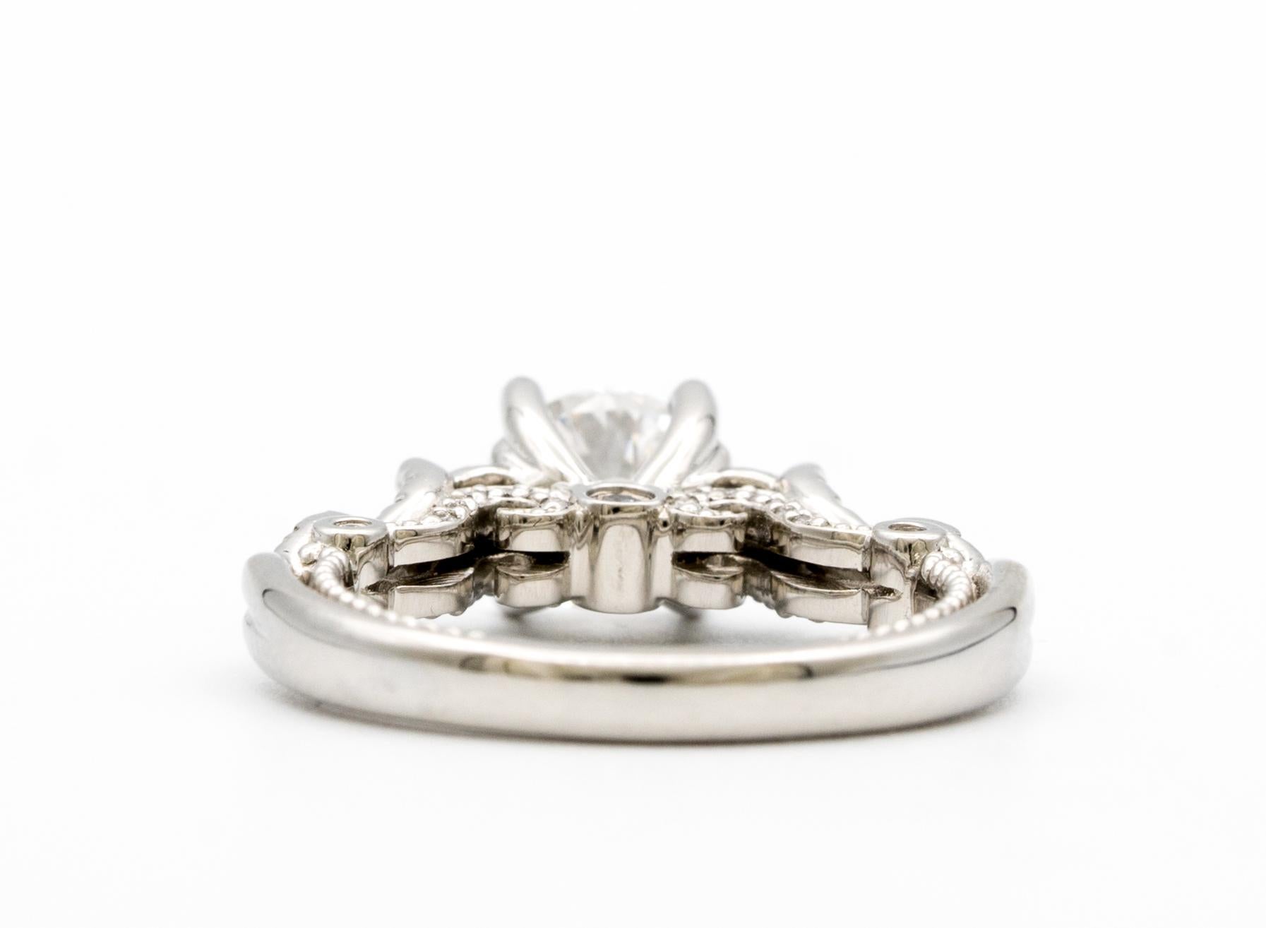 Verragio three stone diamond Engagement Ring , with a twist design, featuring a 1.01 Carat Round Brilliant Centre in Platinum, graded by the GIA color E, and SI1 Clarity.

Designer: Verragio
Collection: INSIGNIA- ( style# 7055R ) 
Center Diamond :