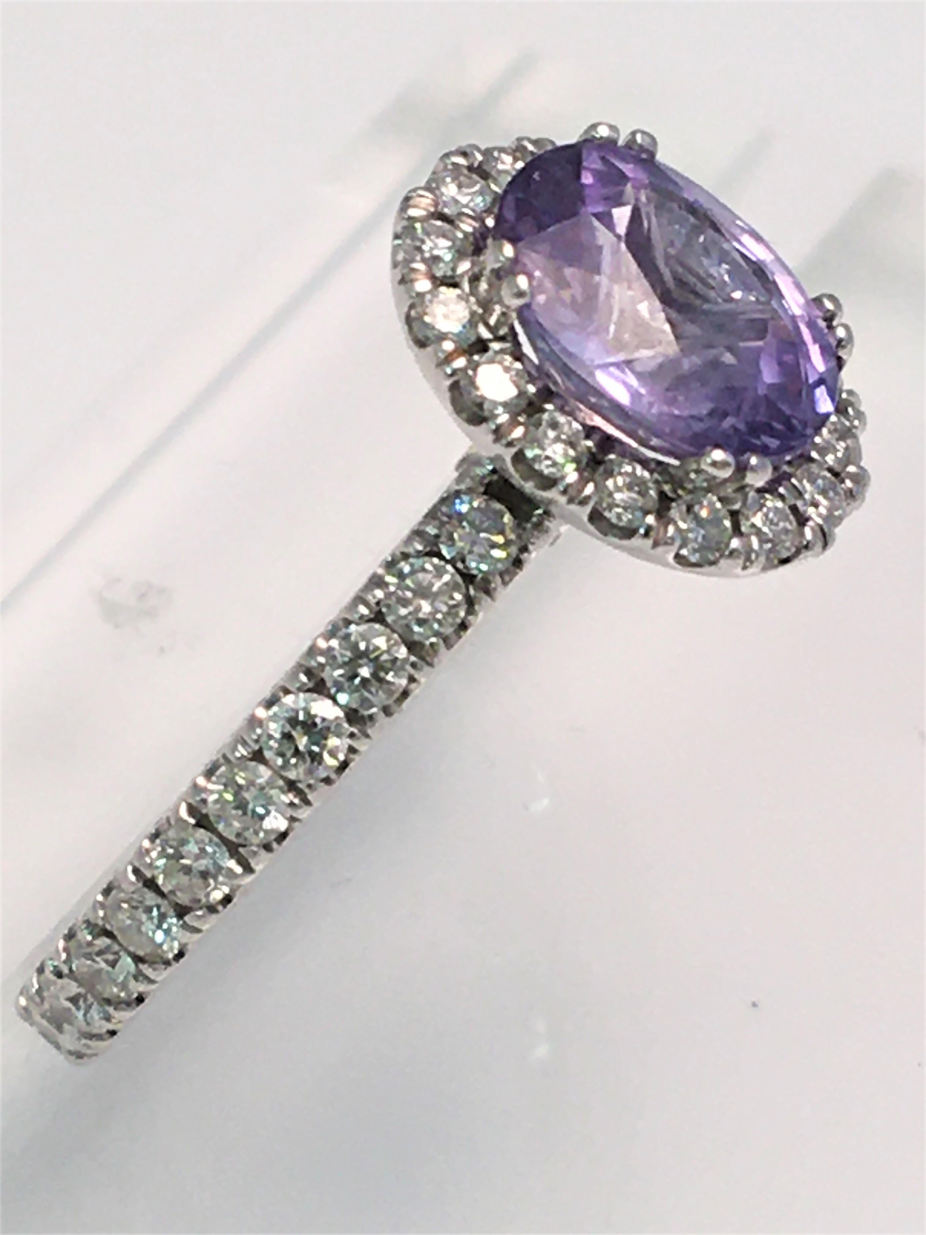 By designer Verragio, a beautiful purple sapphire and diamond ring that will undoubtedly light up a room!!
Approximately 8 X 7mm oval purple sapphire surrounded by round diamonds
Round diamonds also go about 85% of the way around the band
2 round